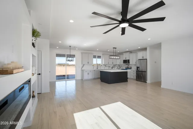 a view of a kitchen with a sink cabinets and outdoor space