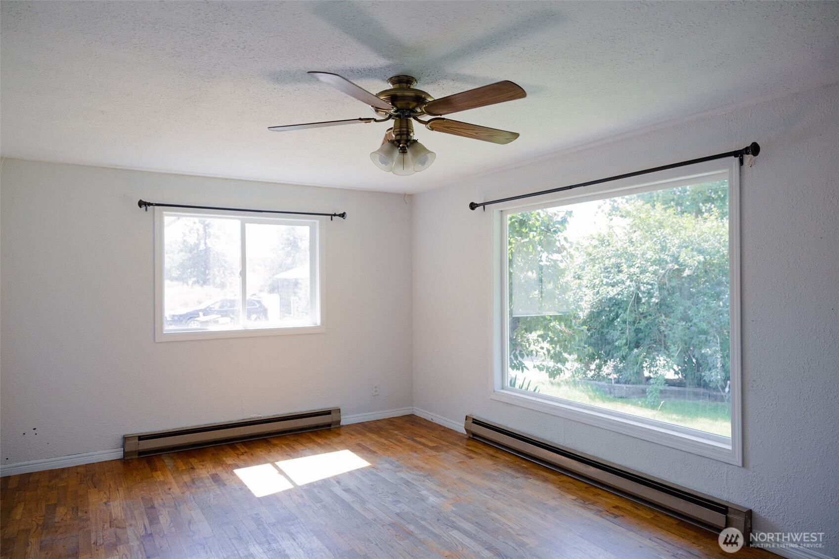 12 A Temby Road Tonasket, WA 98855 - Photo 13 of 36 a view of a room with window wooden floor and windows