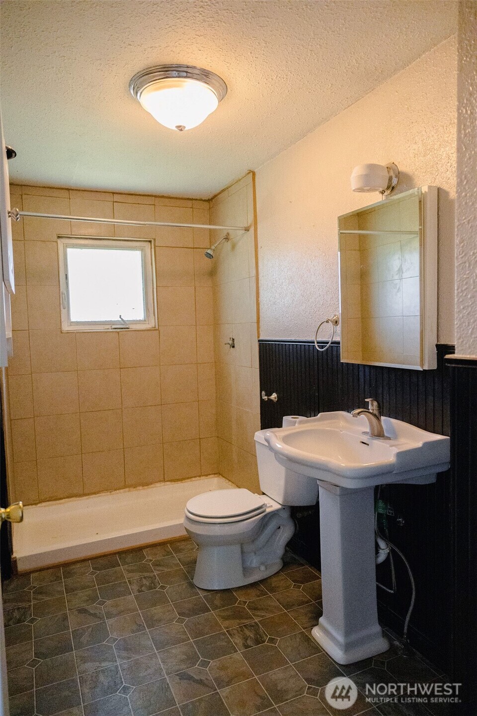 12 A Temby Road Tonasket, WA 98855 - Photo 18 of 36 a bathroom with a sink toilet and shower