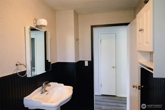 a bathroom with a sink and a mirror