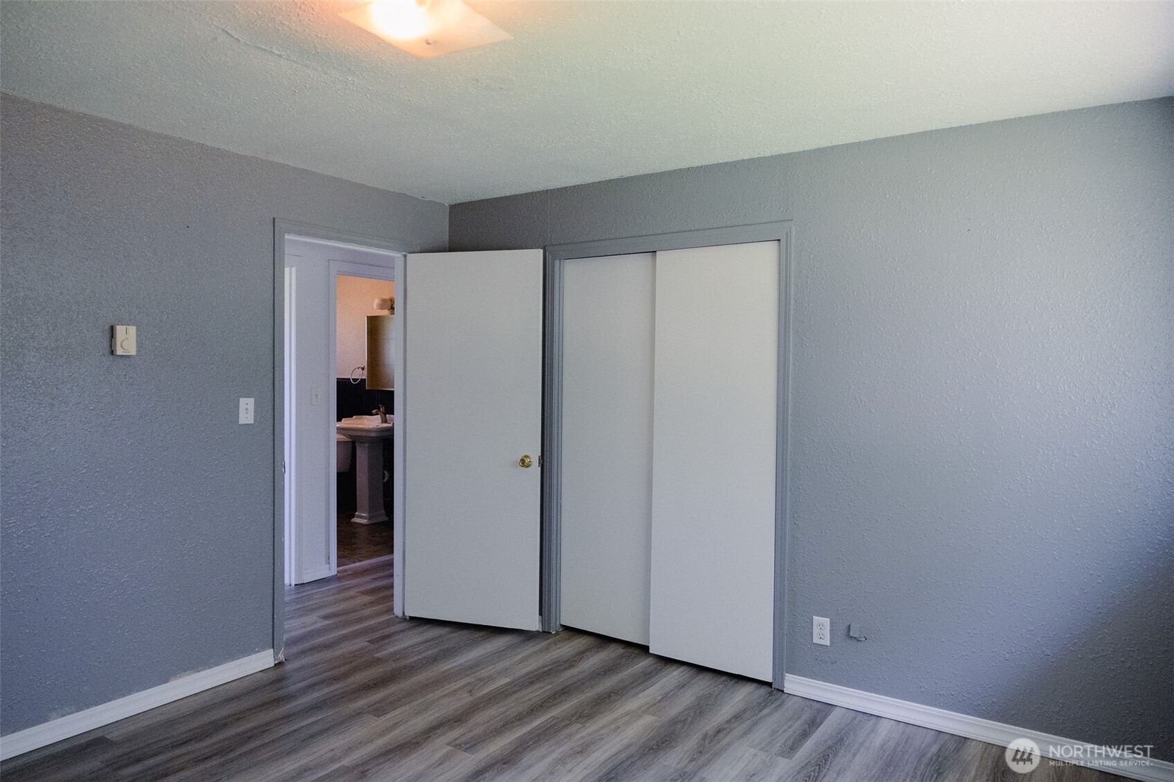 12 A Temby Road Tonasket, WA 98855 - Photo 21 of 36 a view of an empty room and wooden floor