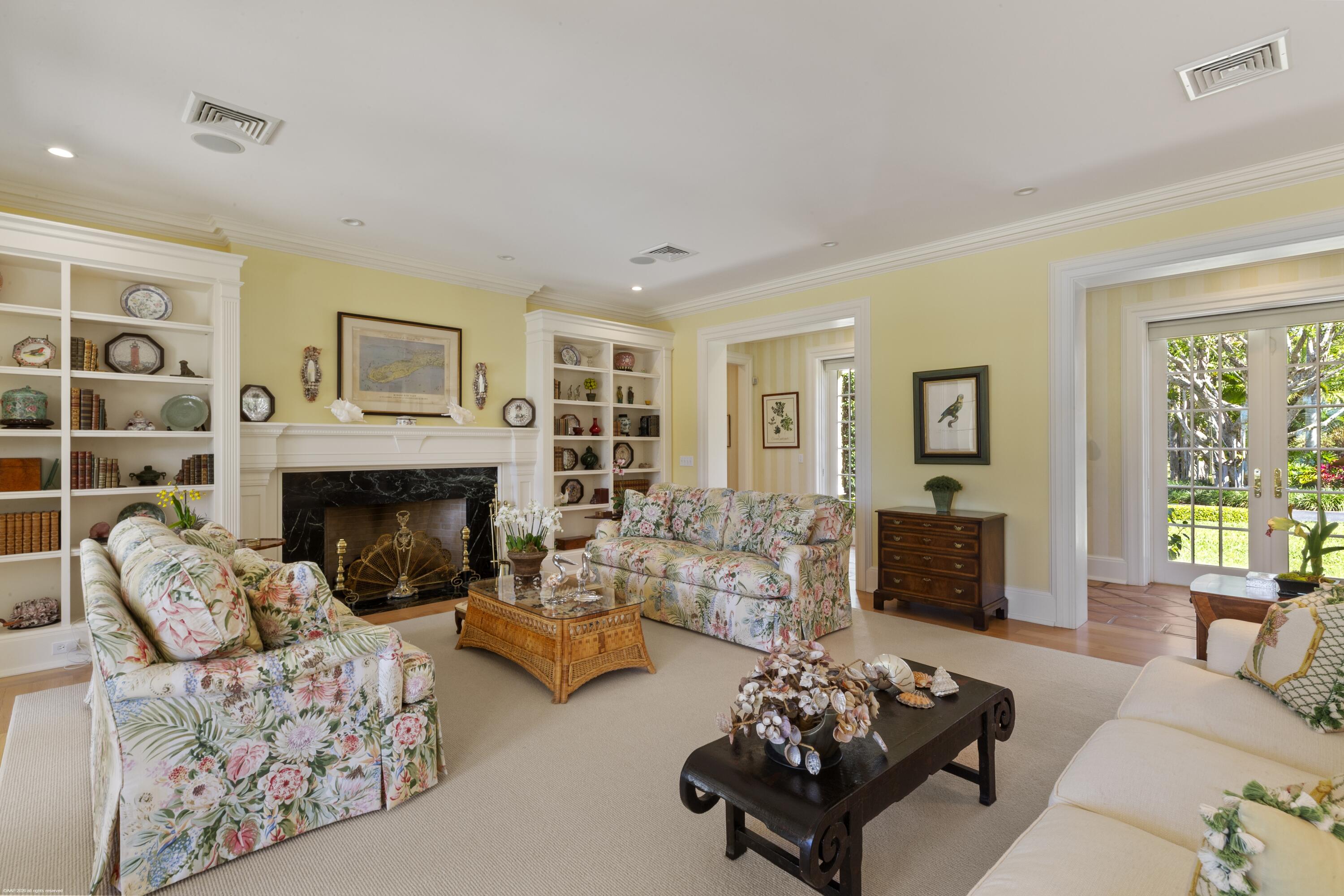 228 South Beach Road Jupiter Island, FL 33455 - Photo 11 of 40 a living room with furniture and a fireplace