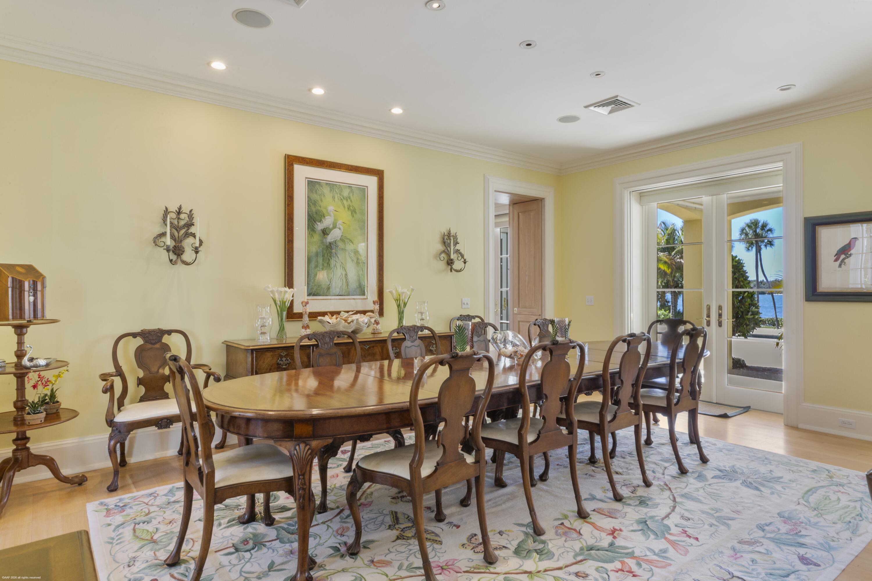 228 South Beach Road Jupiter Island, FL 33455 - Photo 12 of 40 a view of a dining room with furniture