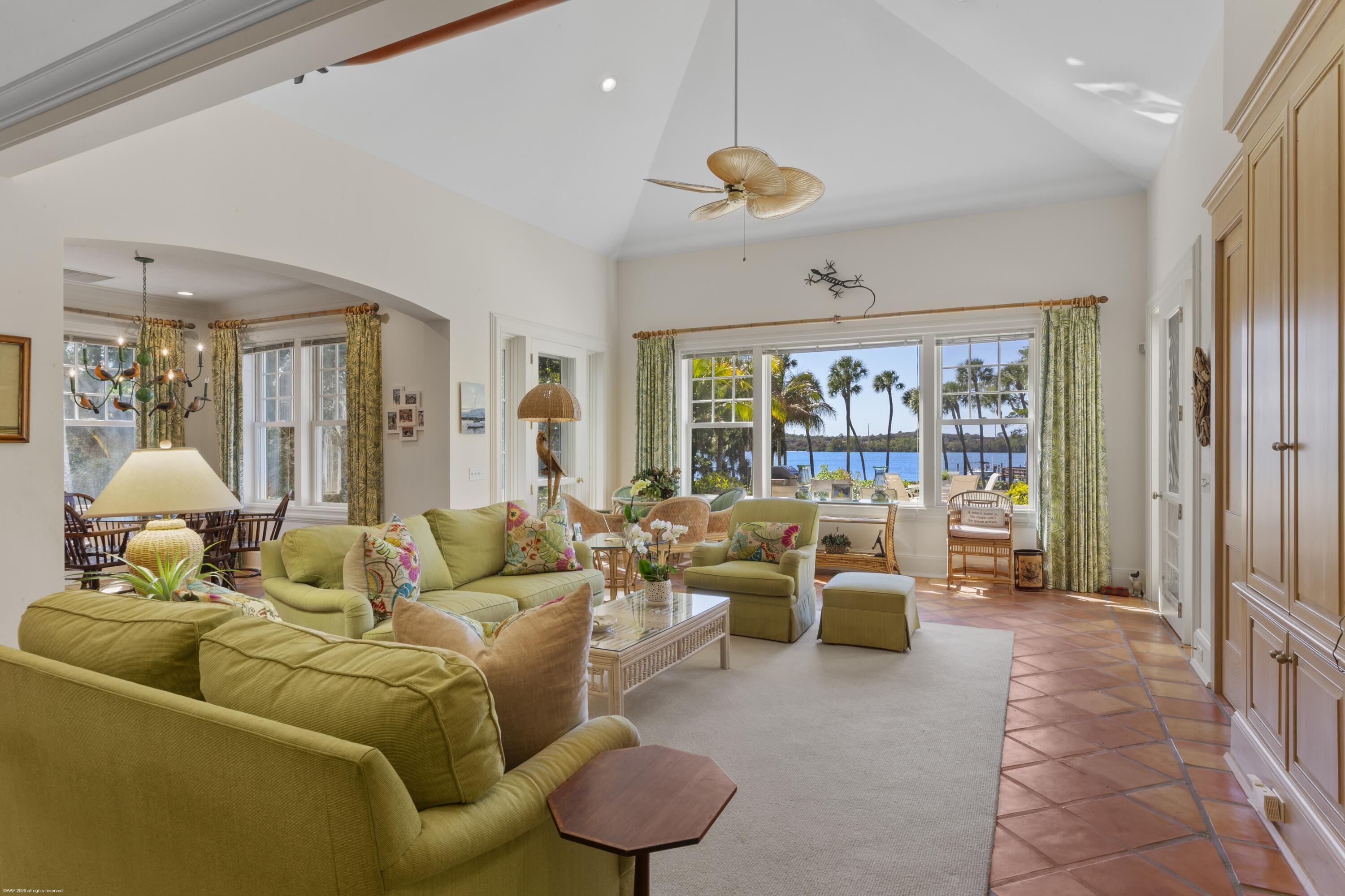 228 South Beach Road Jupiter Island, FL 33455 - Photo 13 of 40 a living room with furniture and a large window
