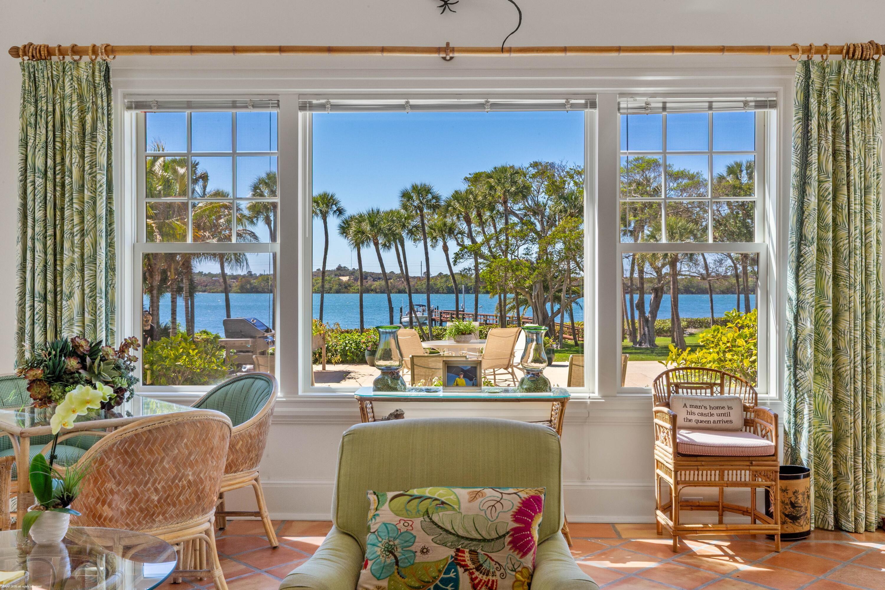 228 South Beach Road Jupiter Island, FL 33455 - Photo 14 of 40 a living room with furniture and a potted plant