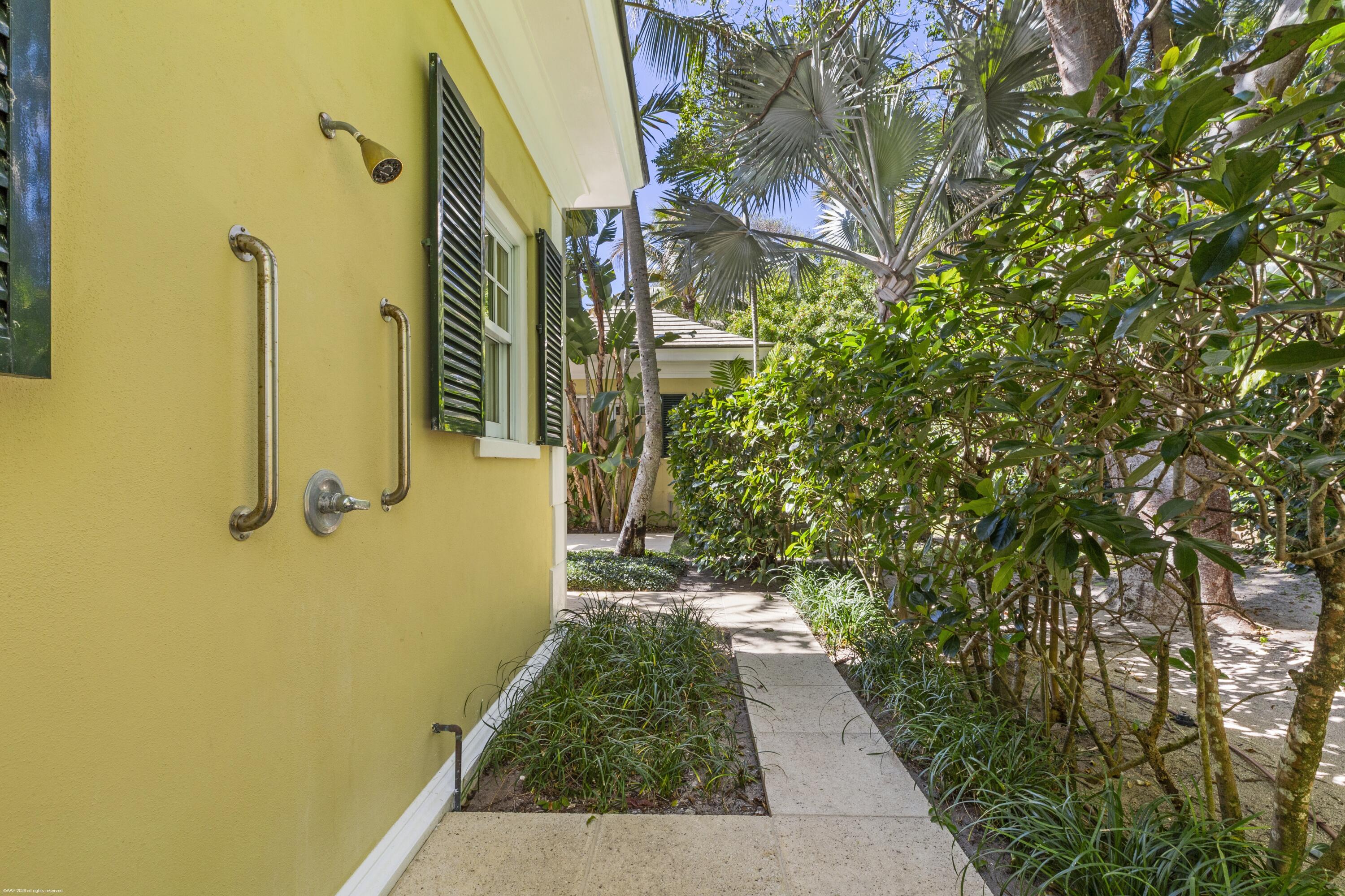 228 South Beach Road Jupiter Island, FL 33455 - Photo 21 of 40 a view of a pathway of a building with large trees