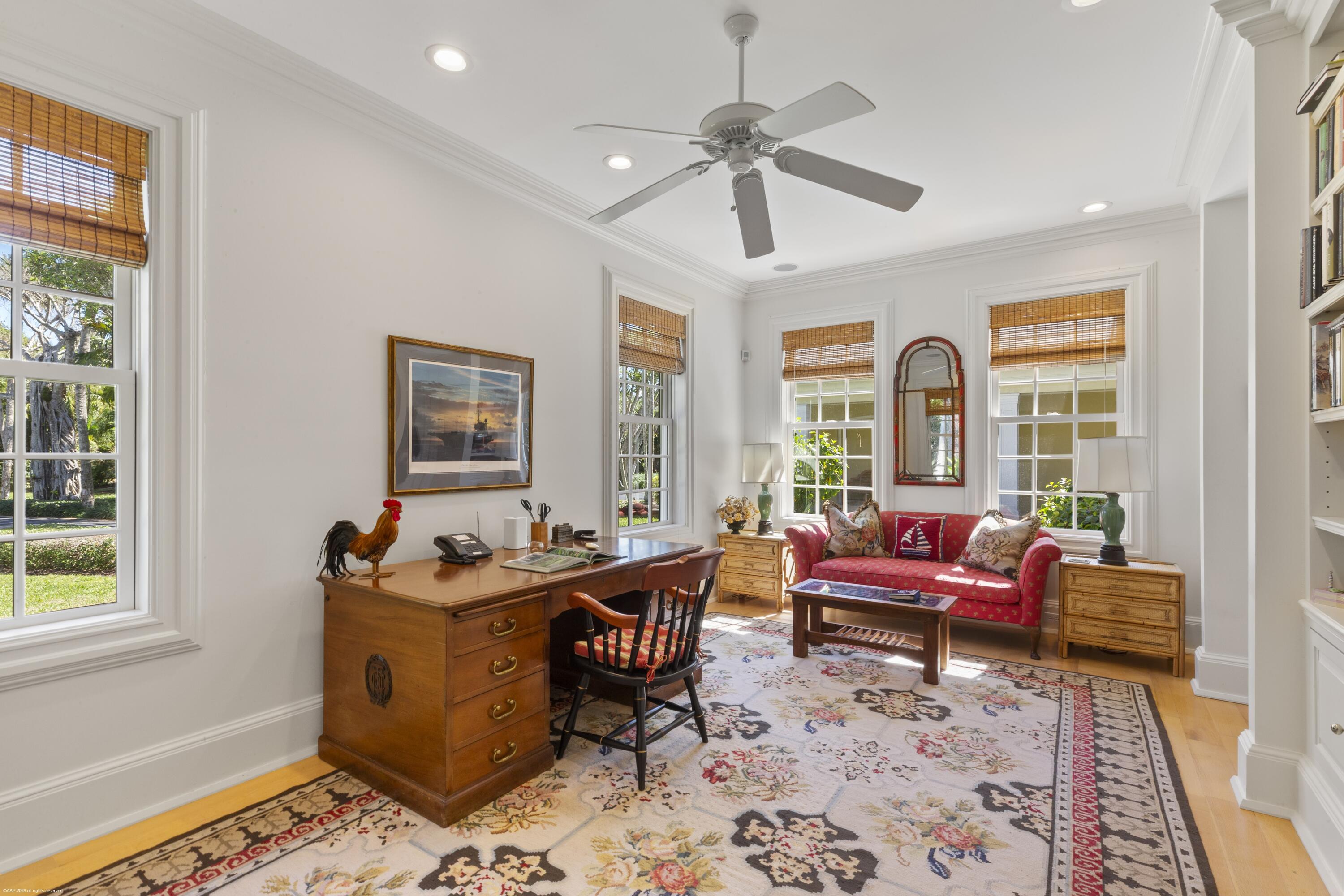 228 South Beach Road Jupiter Island, FL 33455 - Photo 22 of 40 a living room with furniture and a window
