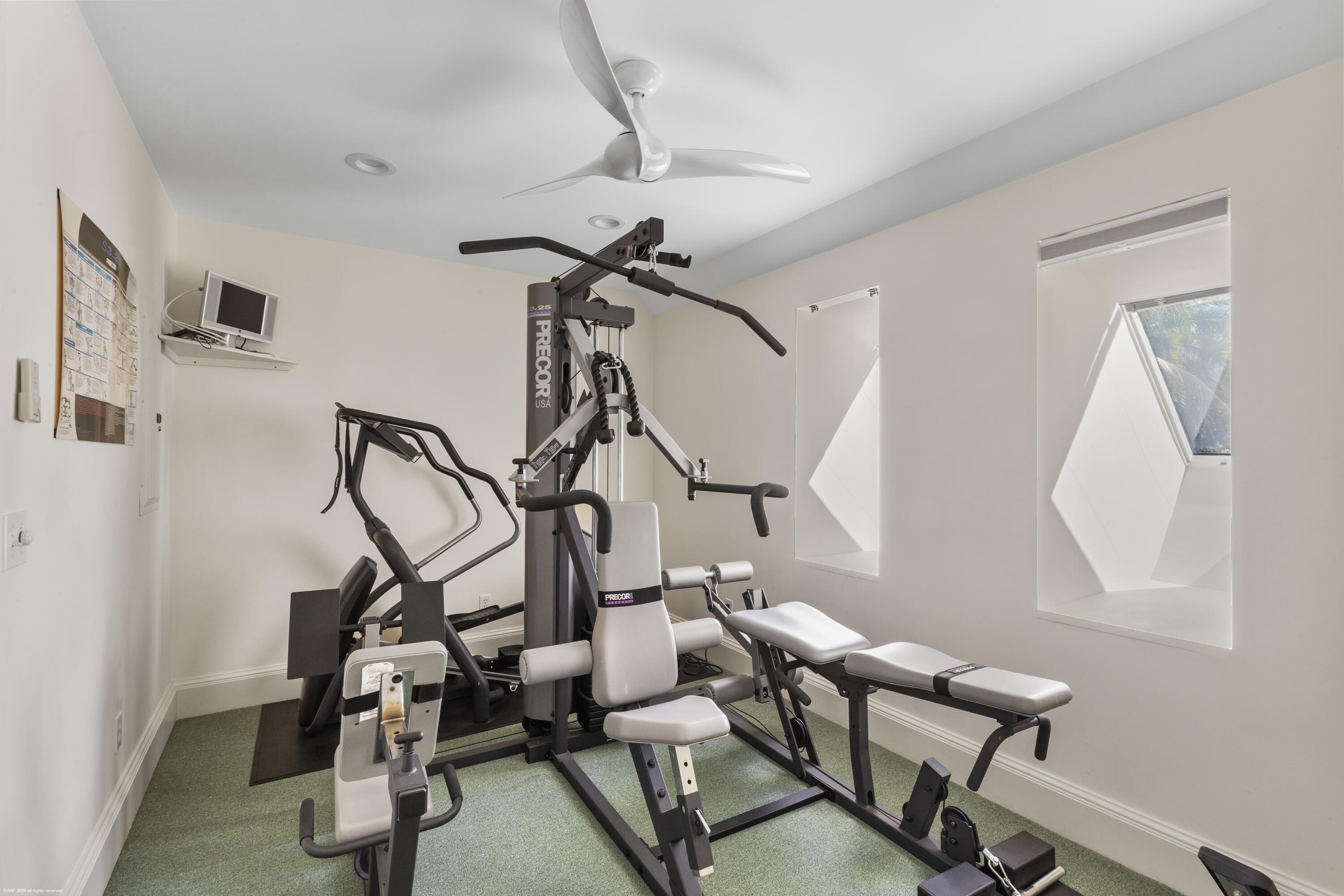 228 South Beach Road Jupiter Island, FL 33455 - Photo 27 of 40 a view of a room with gym equipment