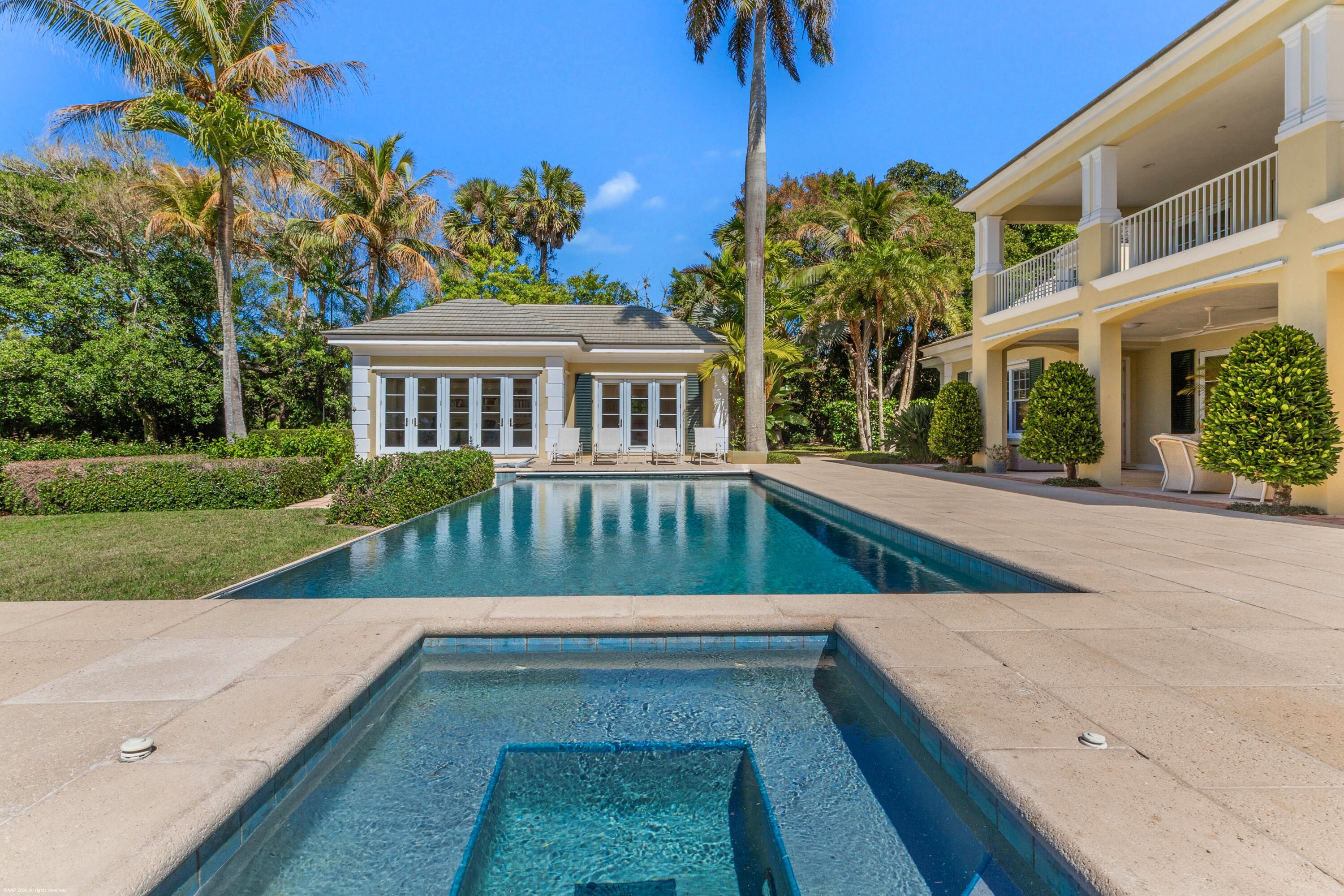 228 South Beach Road Jupiter Island, FL 33455 - Photo 30 of 40 a view of a house with a yard