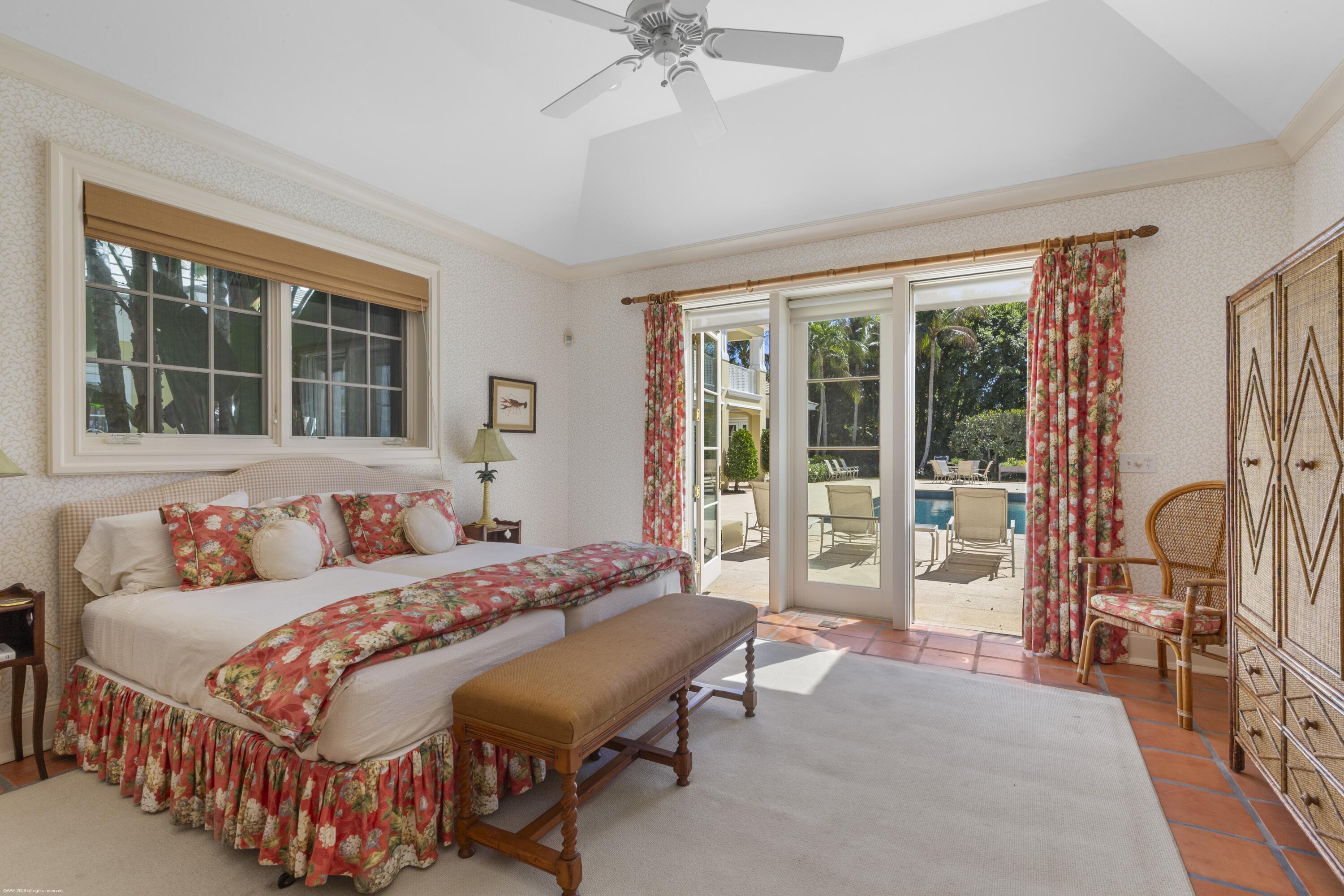 228 South Beach Road Jupiter Island, FL 33455 - Photo 33 of 40 a bedroom with a bed and a large window with outer view