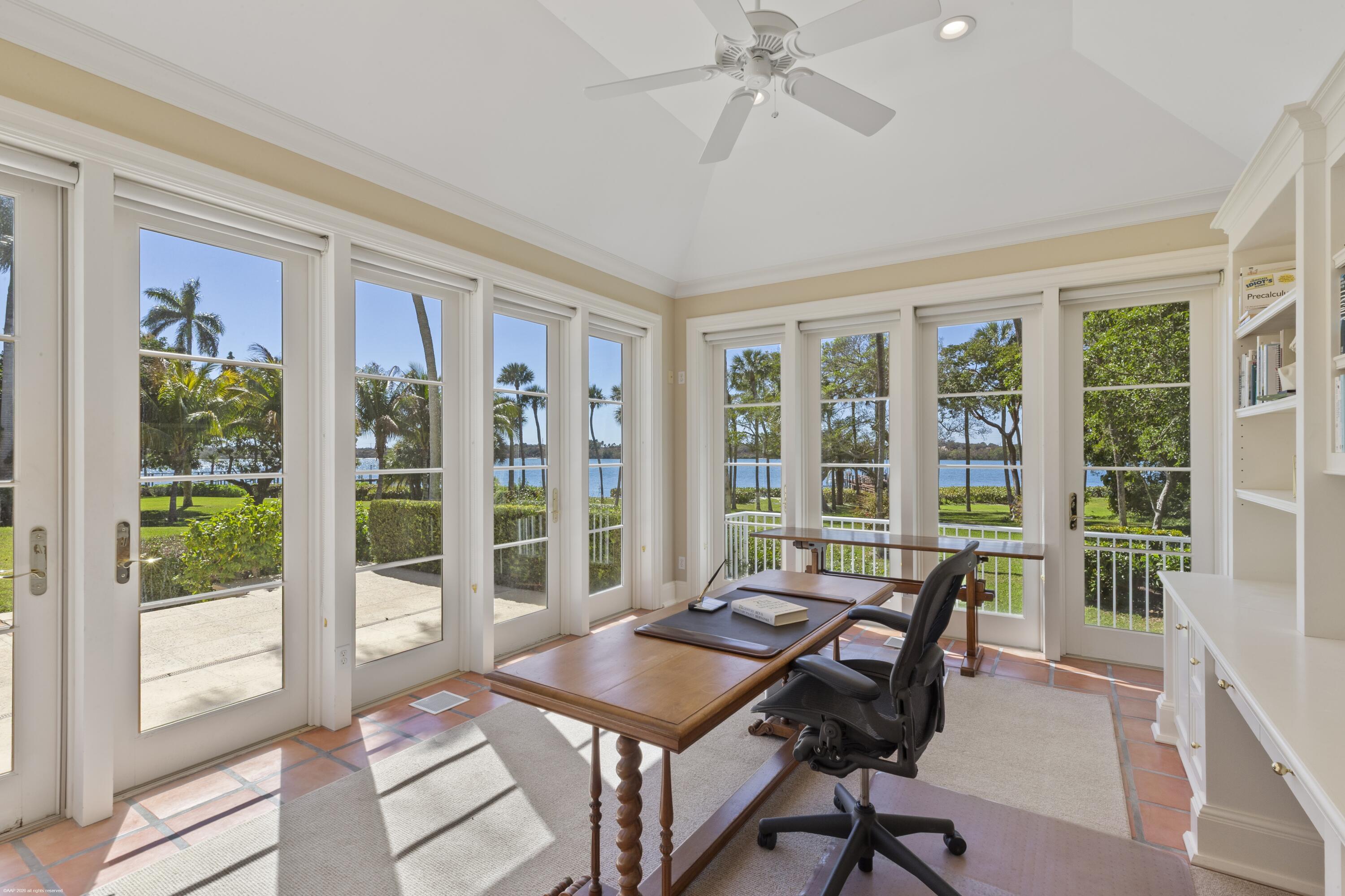 228 South Beach Road Jupiter Island, FL 33455 - Photo 34 of 40 a view of a workspace with furniture and a window