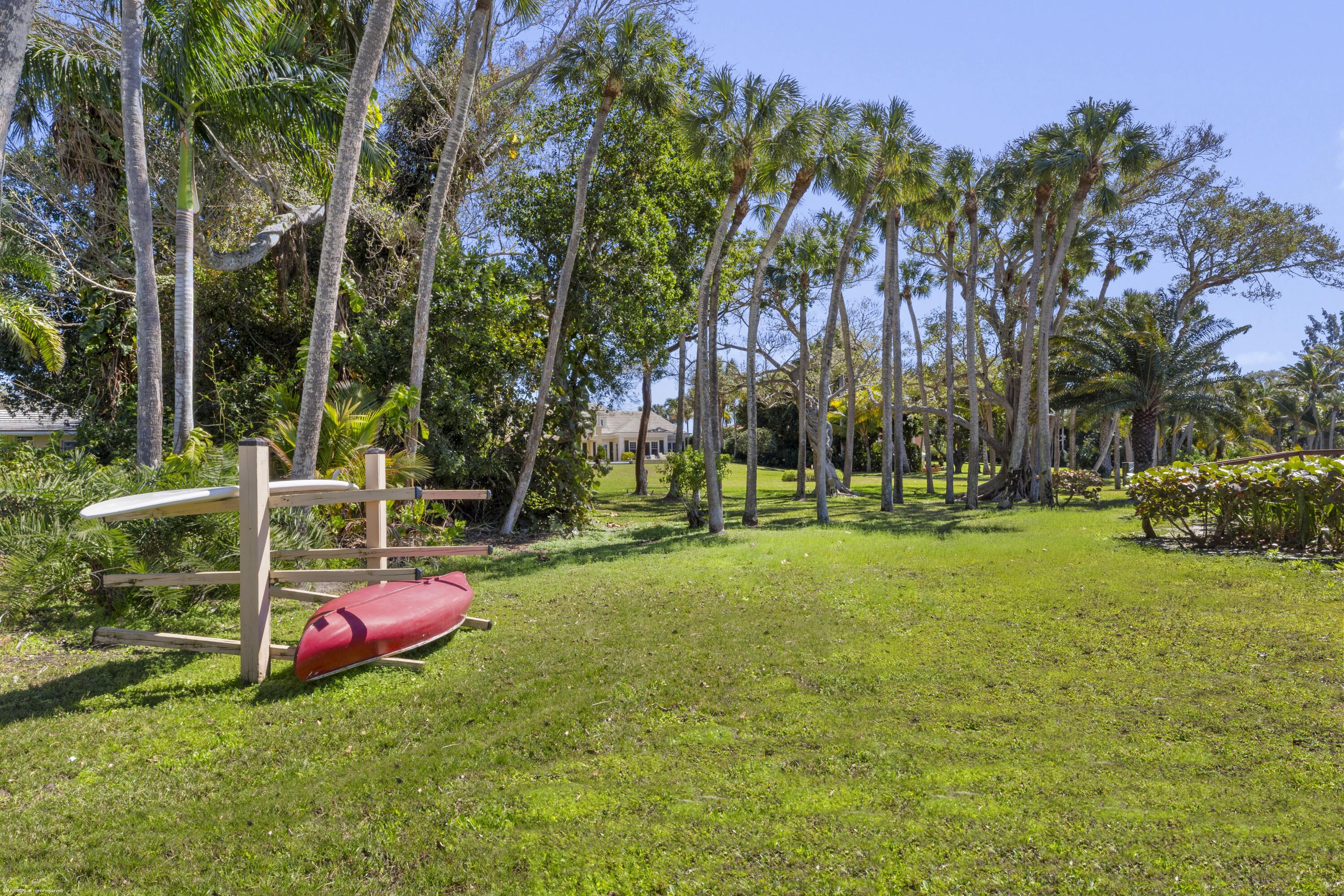 228 South Beach Road Jupiter Island, FL 33455 - Photo 36 of 40 a view of a park with large trees