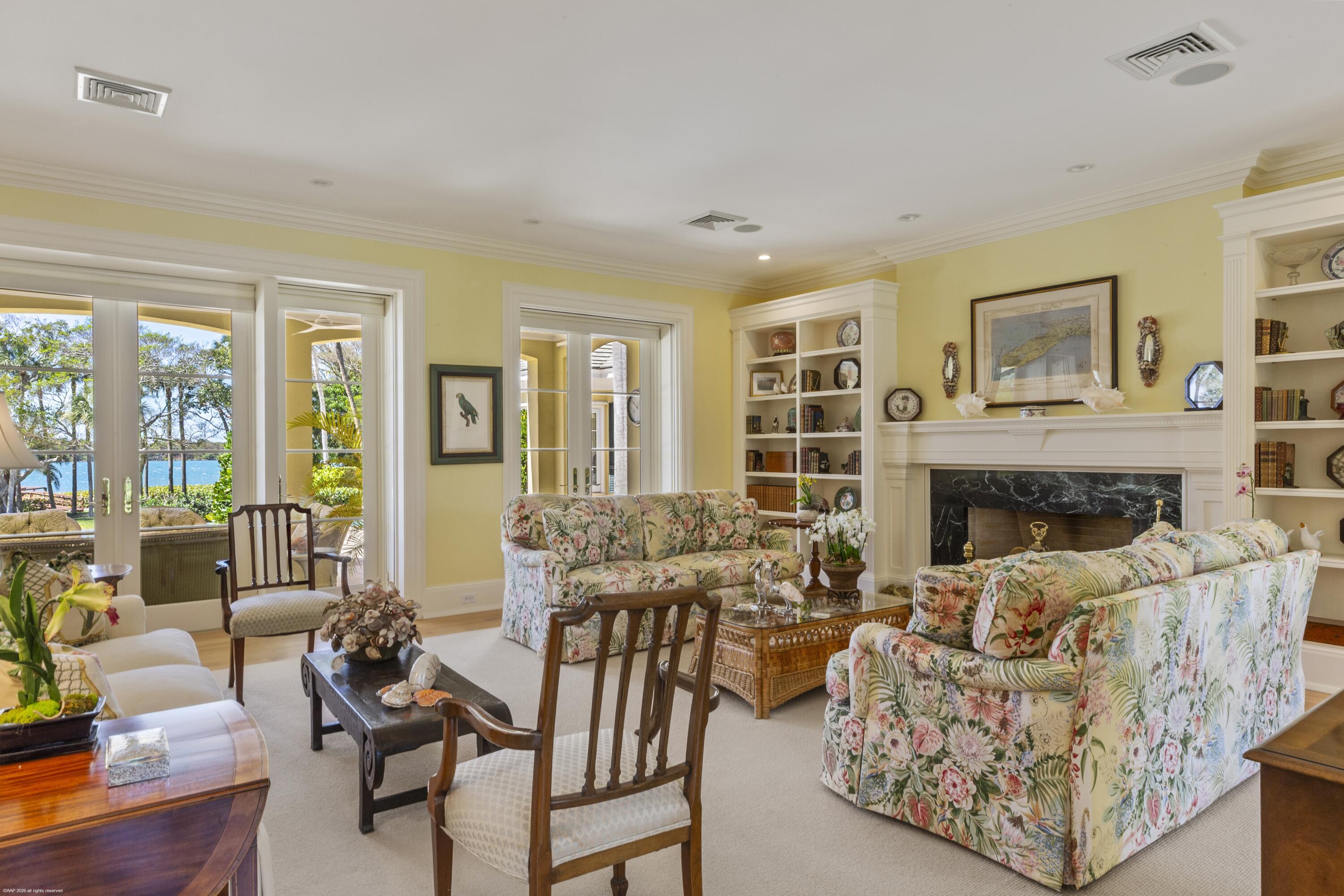 228 South Beach Road Jupiter Island, FL 33455 - Photo 10 of 40 a living room with furniture and a fireplace