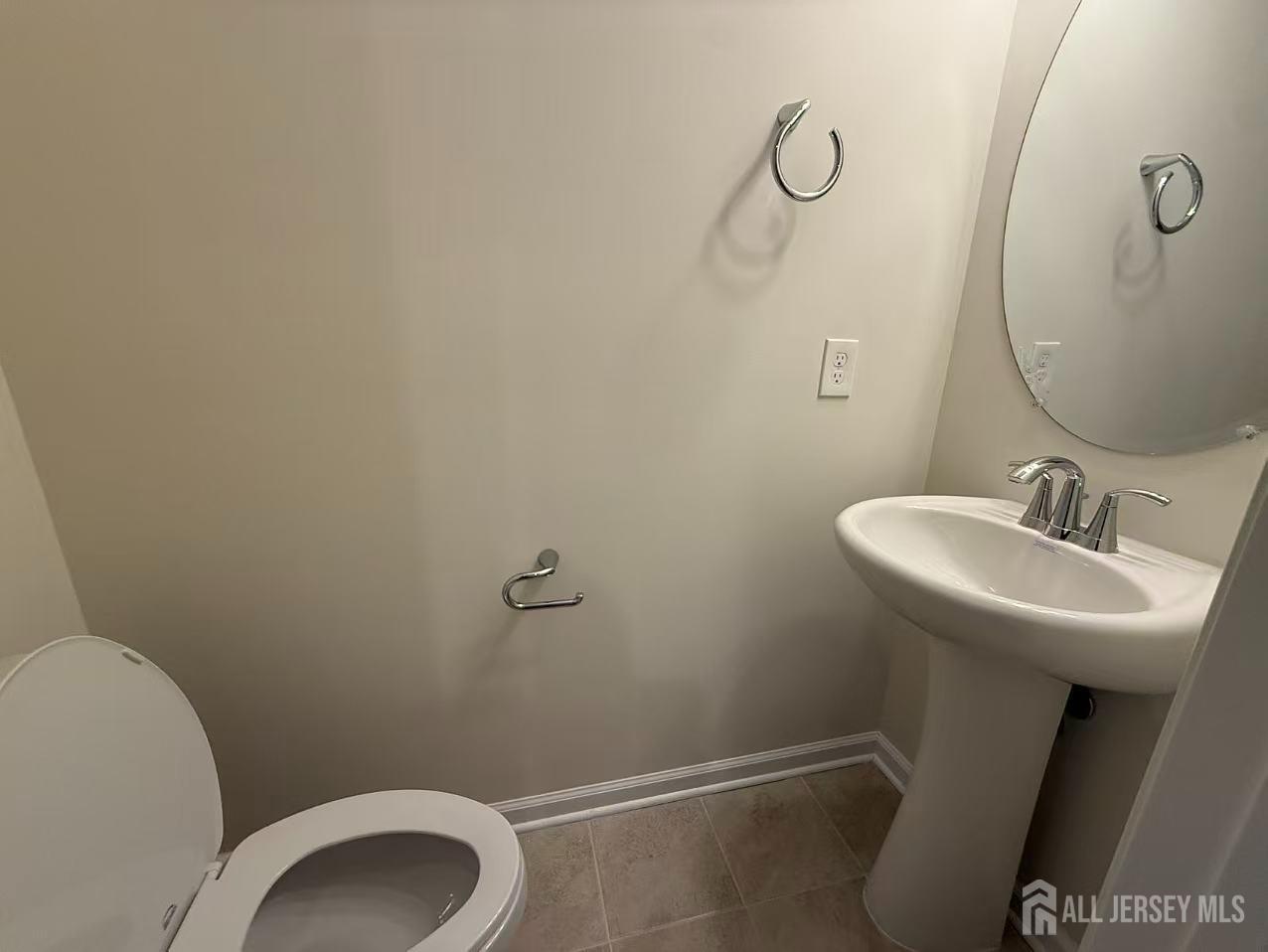 616 Sadie Circle New Brunswick, NJ 08901 - Photo 15 of 18 a bathroom with a sink and toilet