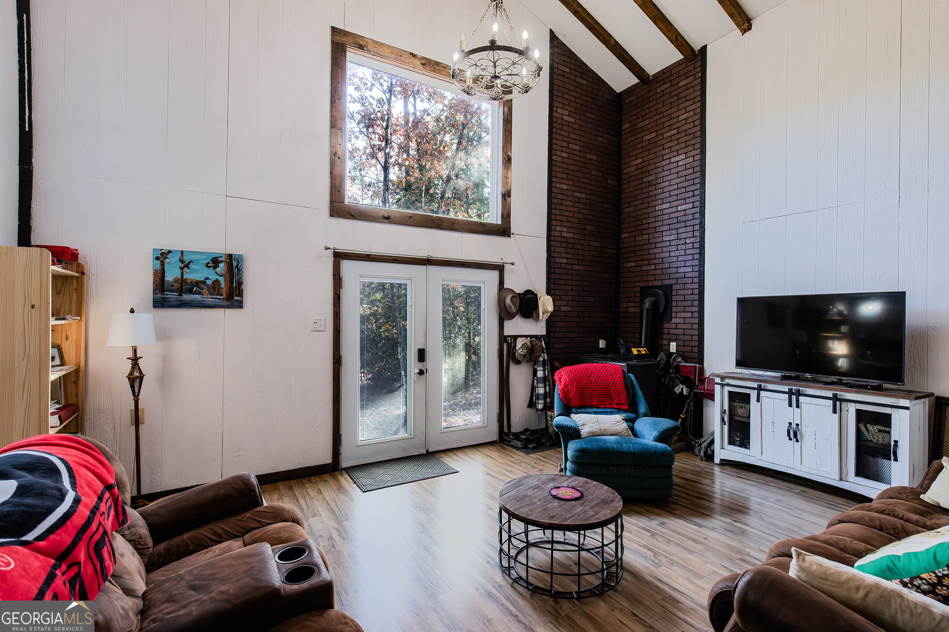 2286 Carter Bight Landing Road Surrency, GA 31563 - Photo 11 of 35 a living room with furniture and a flat screen tv