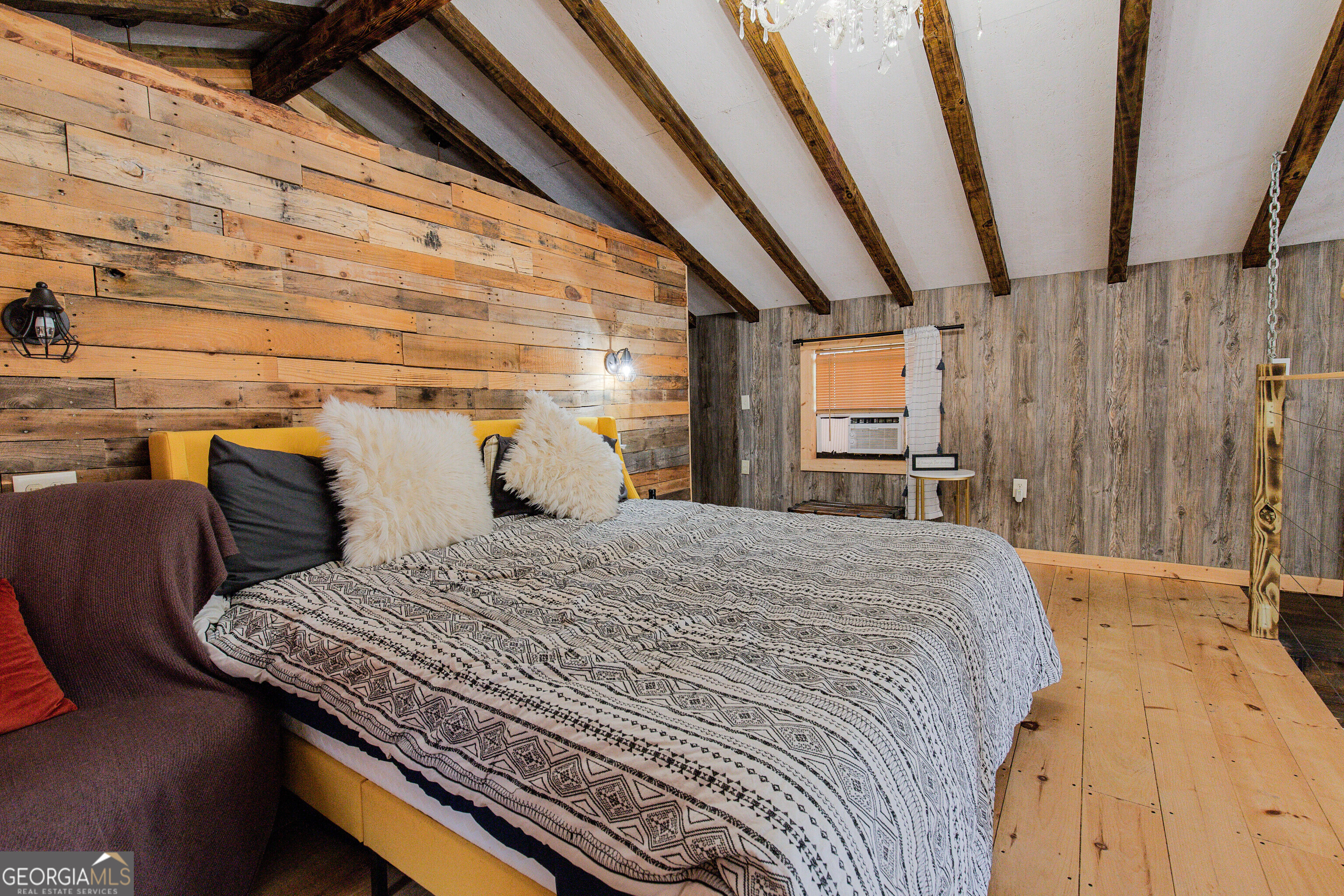 2286 Carter Bight Landing Road Surrency, GA 31563 - Photo 12 of 35 a bedroom with a bed and wooden floor