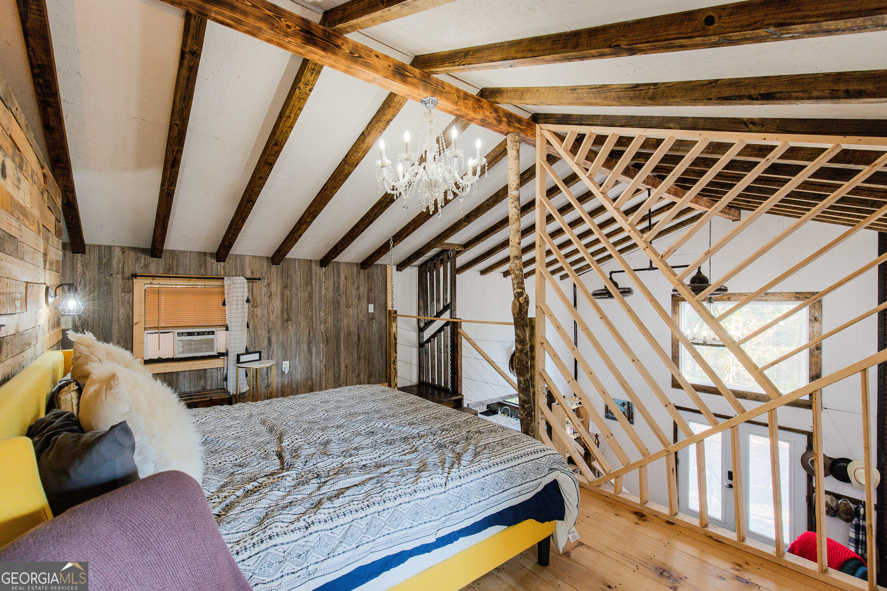 2286 Carter Bight Landing Road Surrency, GA 31563 - Photo 13 of 35 a bedroom with a bed and a walk in closet