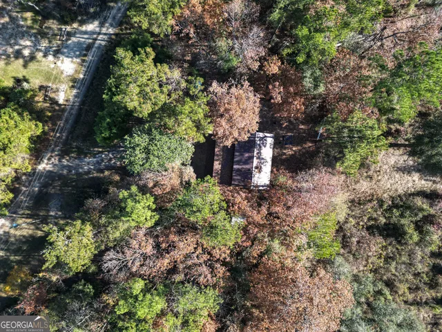 a view of a city with lush green forest