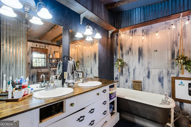 a bathroom with a double vanity sink and a mirror