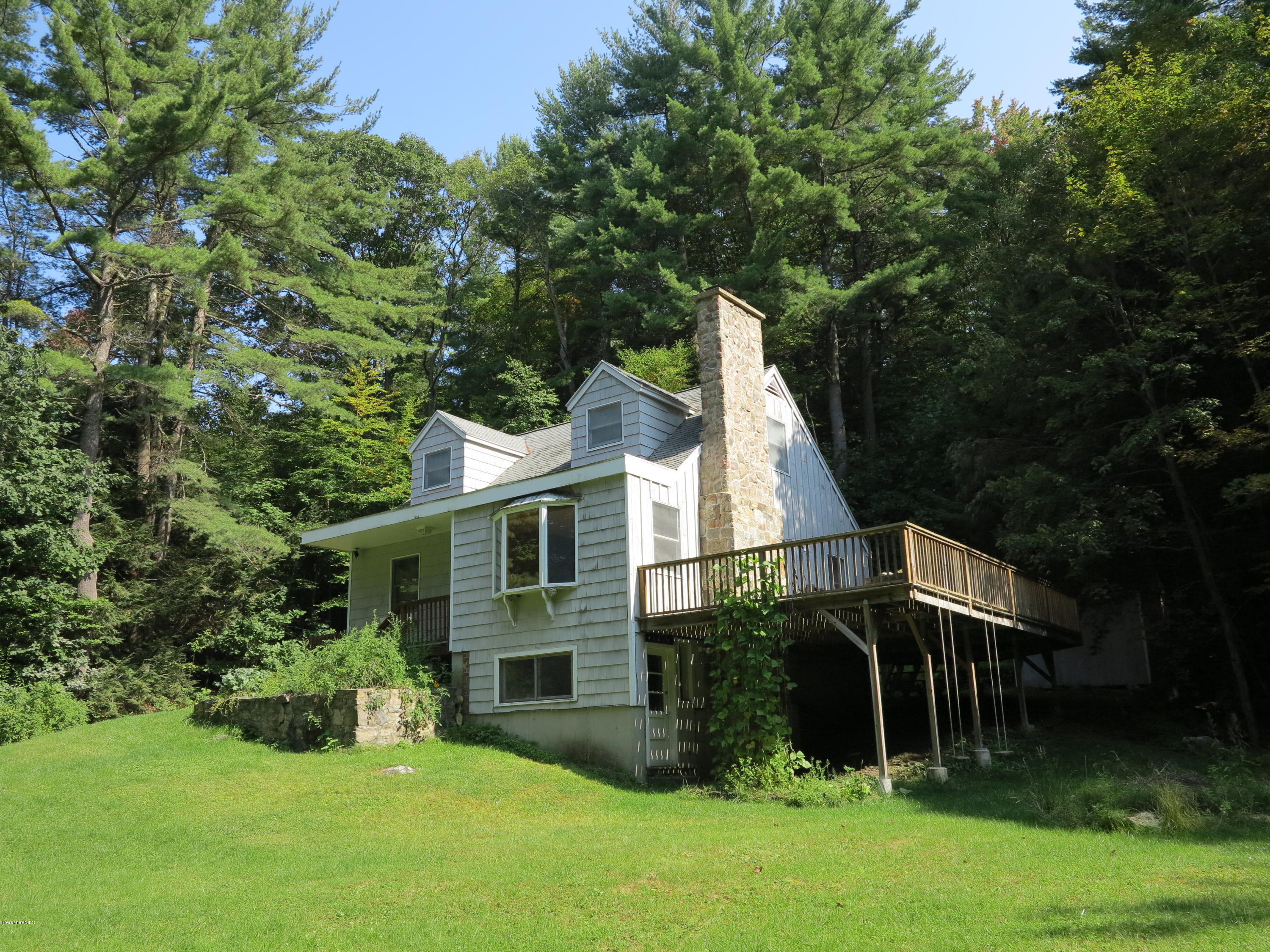 98 Tyringham Road Otis, MA 01253 - Photo 1 of 17 a view of house with outdoor space and garden
