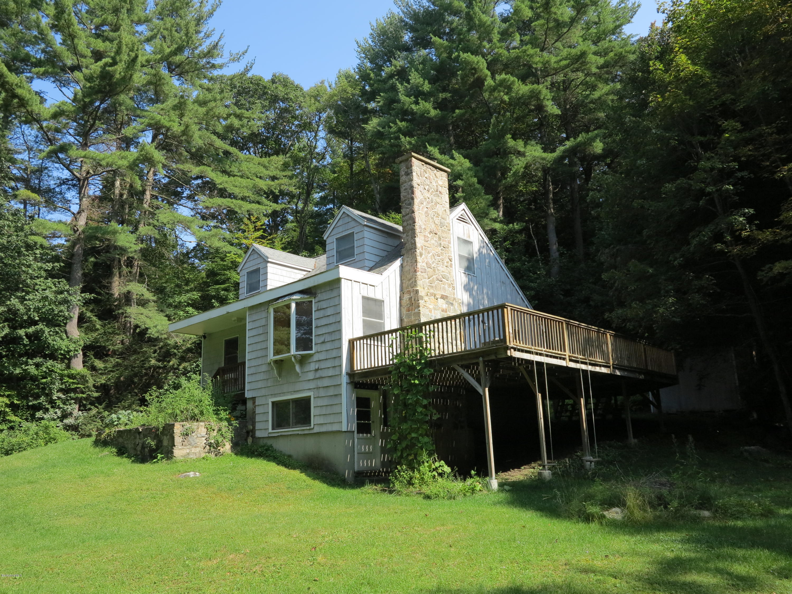 98 Tyringham Road Otis, MA 01253 - Photo 14 of 17 a view of house with garden