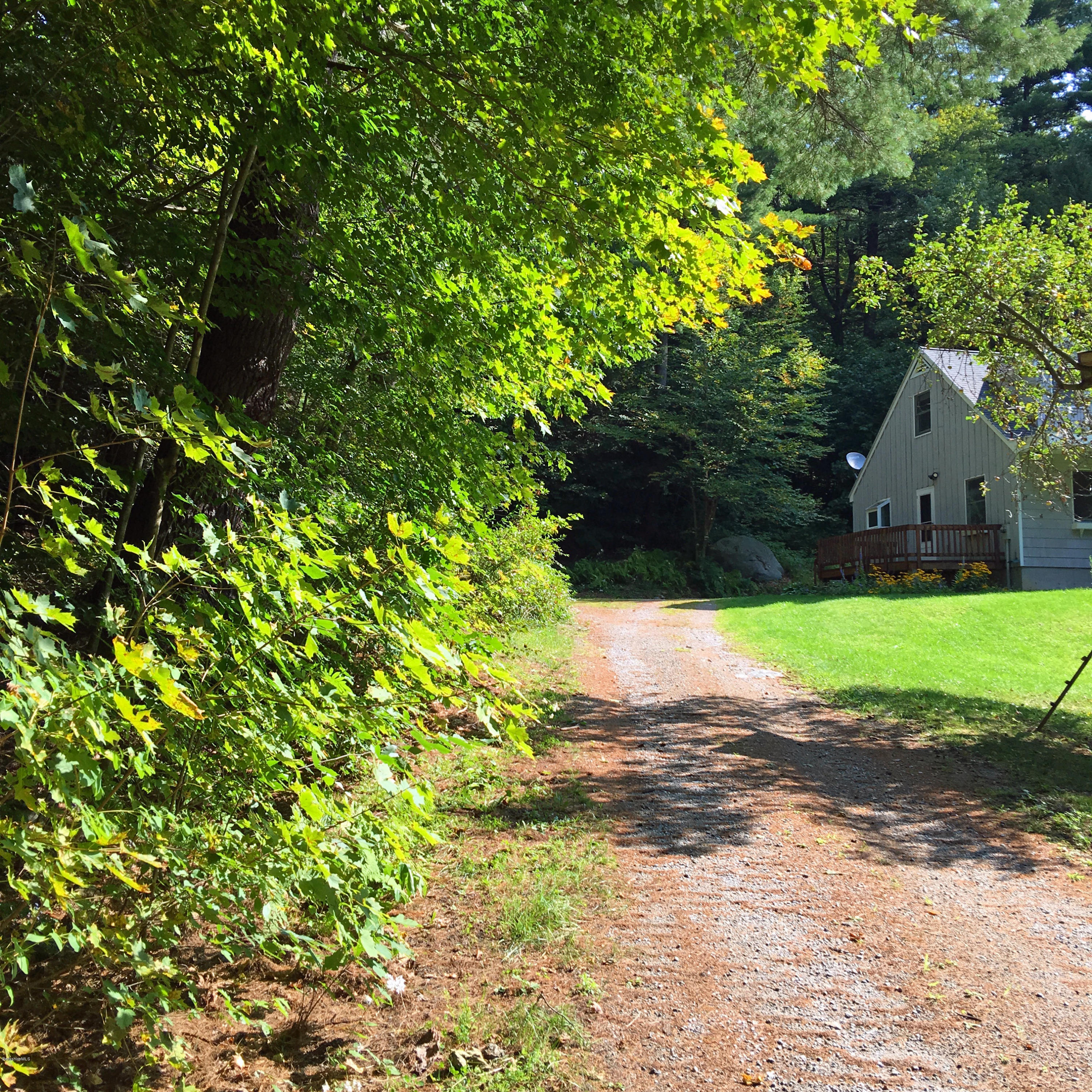 98 Tyringham Road Otis, MA 01253 - Photo 16 of 17 a view of a house with a yard