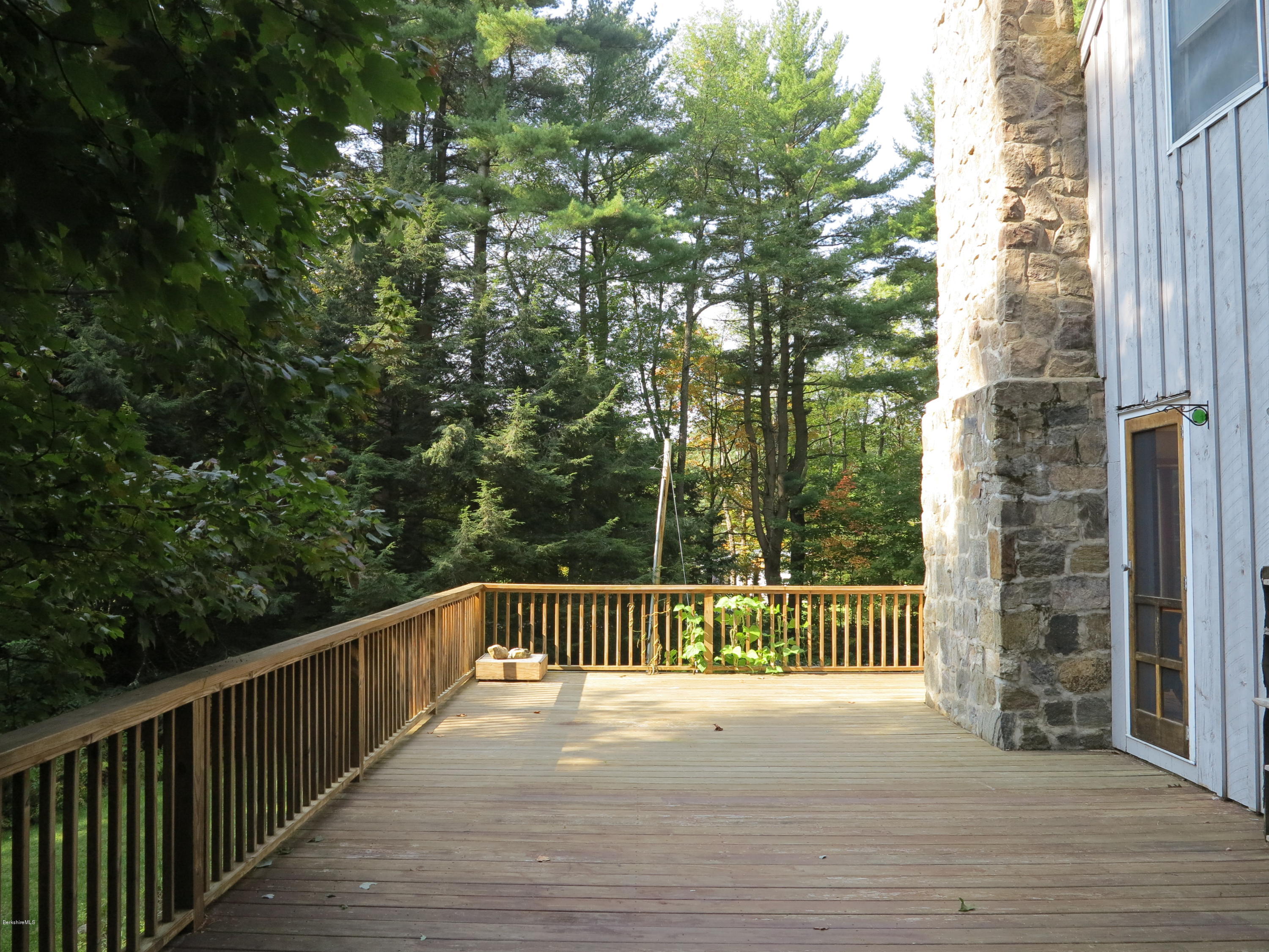 98 Tyringham Road Otis, MA 01253 - Photo 5 of 17 a view of a city street from a balcony