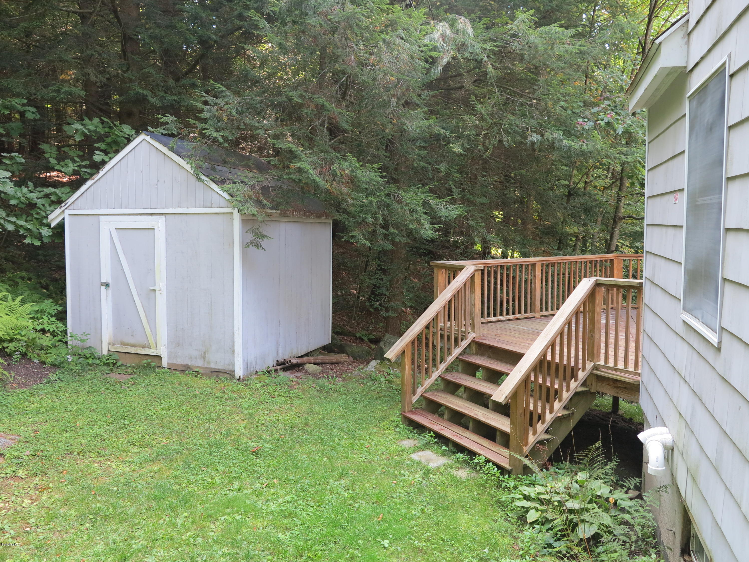 98 Tyringham Road Otis, MA 01253 - Photo 10 of 17 a view of a deck with a yard