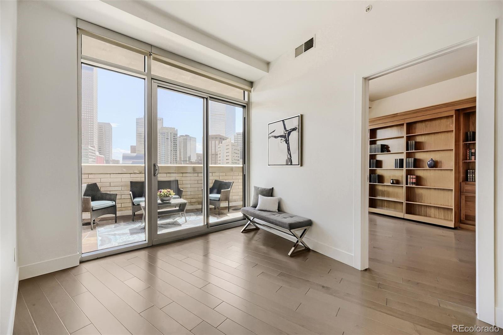 2001 Lincoln Street, Unit 710 Denver, CO 80202 - Photo 5 of 27 wooden floor and windows in a room