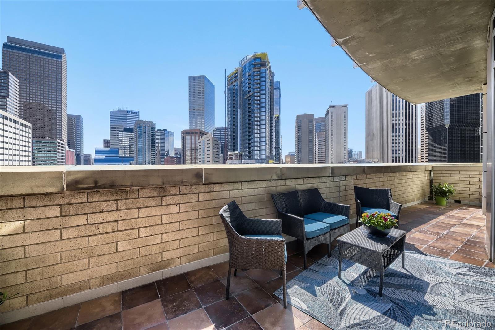 2001 Lincoln Street, Unit 710 Denver, CO 80202 - Photo 6 of 27 a terrace with outdoor seating and city view