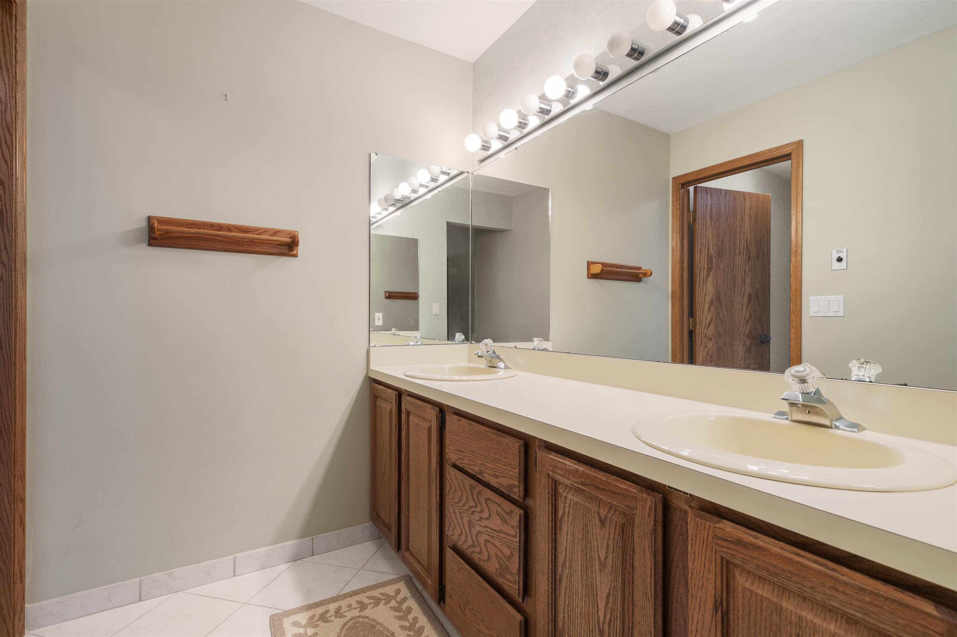 1732 Rowntree Lane Rockford, IL 61107 - Photo 11 of 26 a bathroom with a sink and a mirror