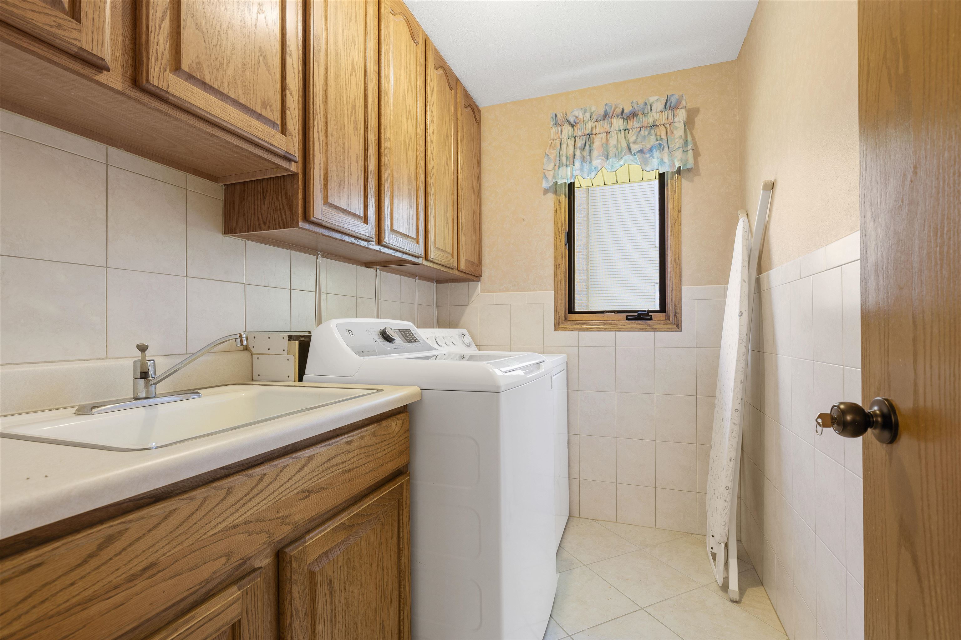 1732 Rowntree Lane Rockford, IL 61107 - Photo 15 of 26 a bathroom with a sink and a mirror