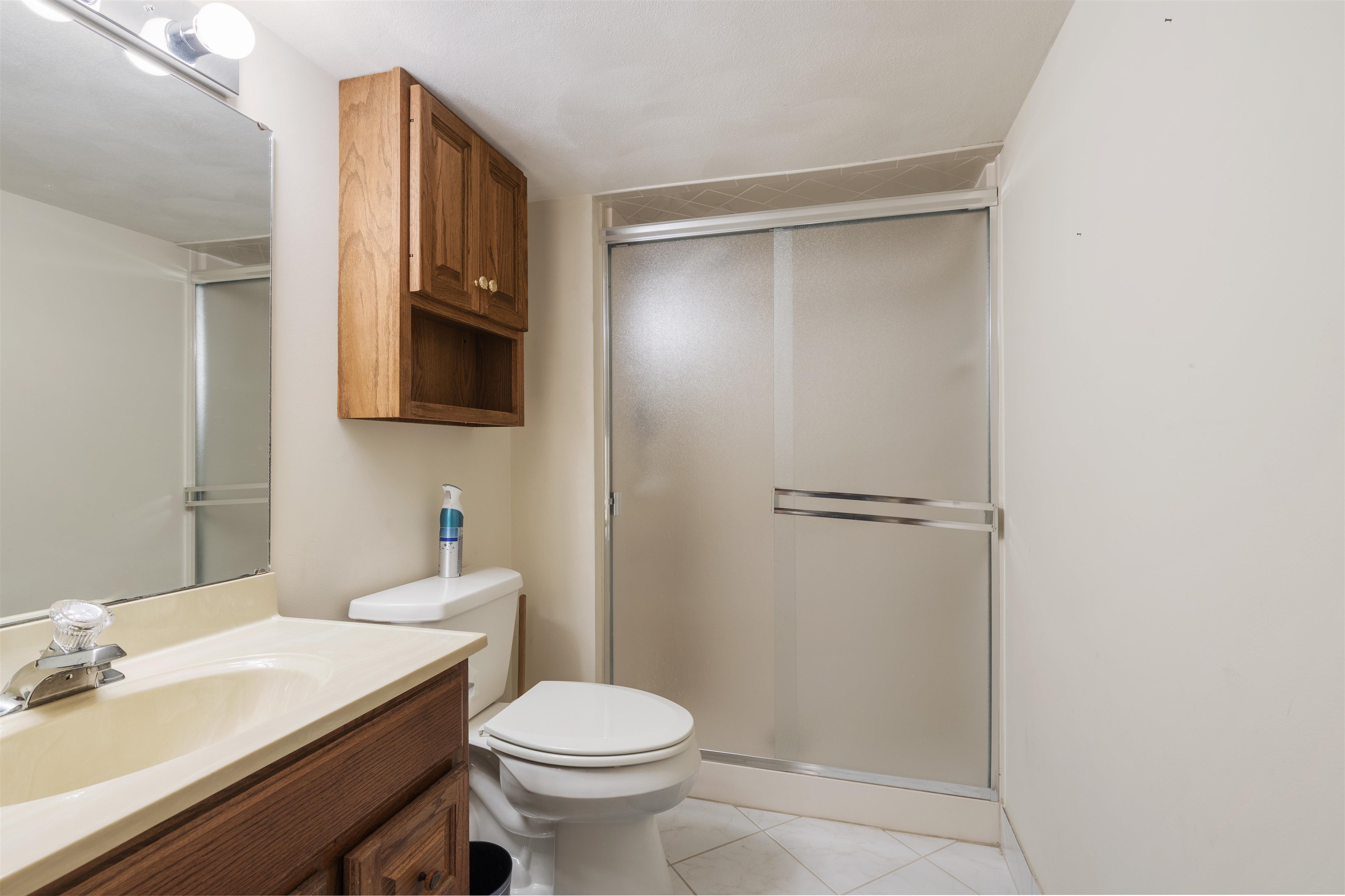 1732 Rowntree Lane Rockford, IL 61107 - Photo 18 of 26 a bathroom with a sink a toilet and shower