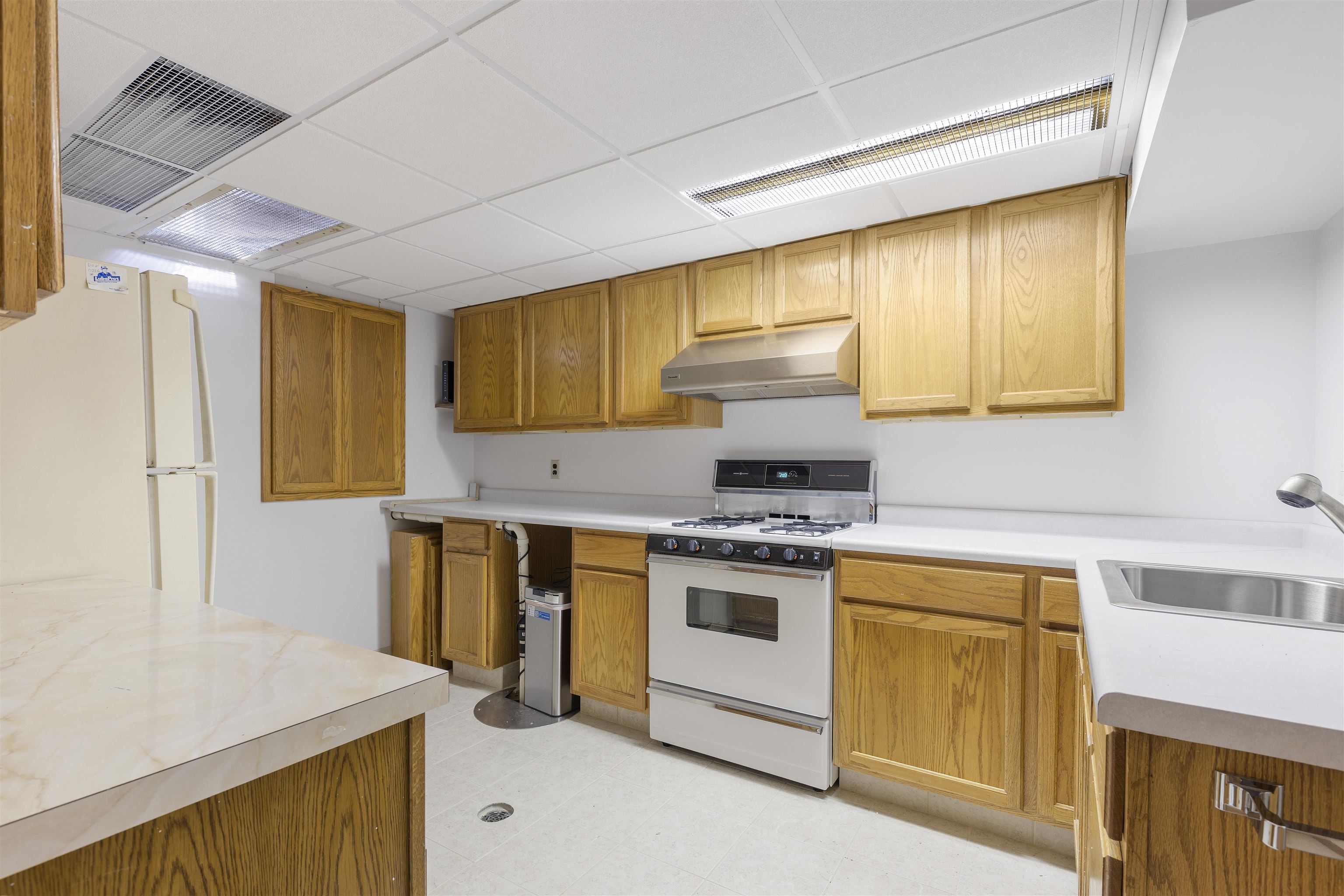 1732 Rowntree Lane Rockford, IL 61107 - Photo 19 of 26 a kitchen with a sink stove and cabinets