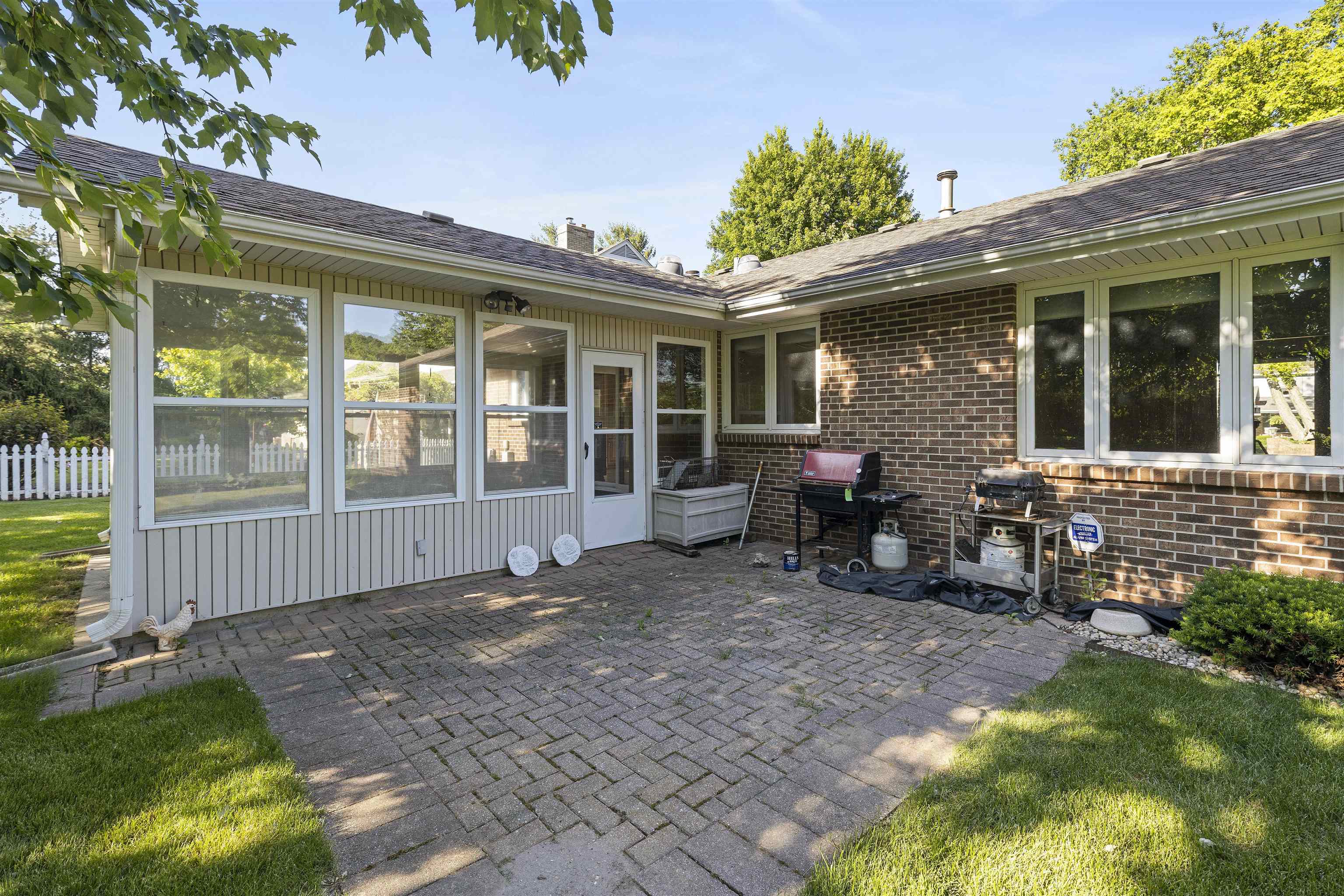 1732 Rowntree Lane Rockford, IL 61107 - Photo 23 of 26 a view of a house with backyard sitting area and garden