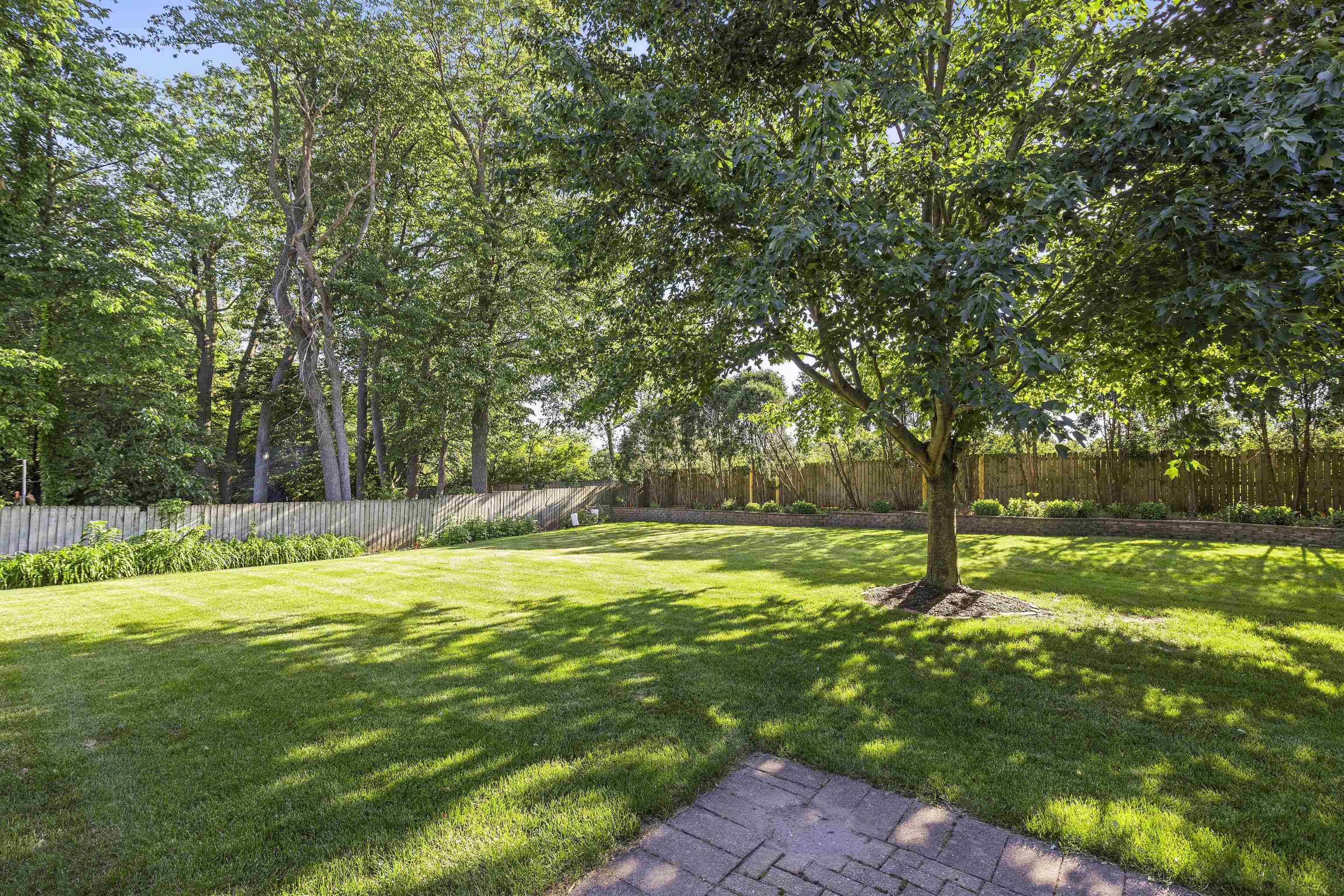 1732 Rowntree Lane Rockford, IL 61107 - Photo 24 of 26 a view of a yard with a large trees