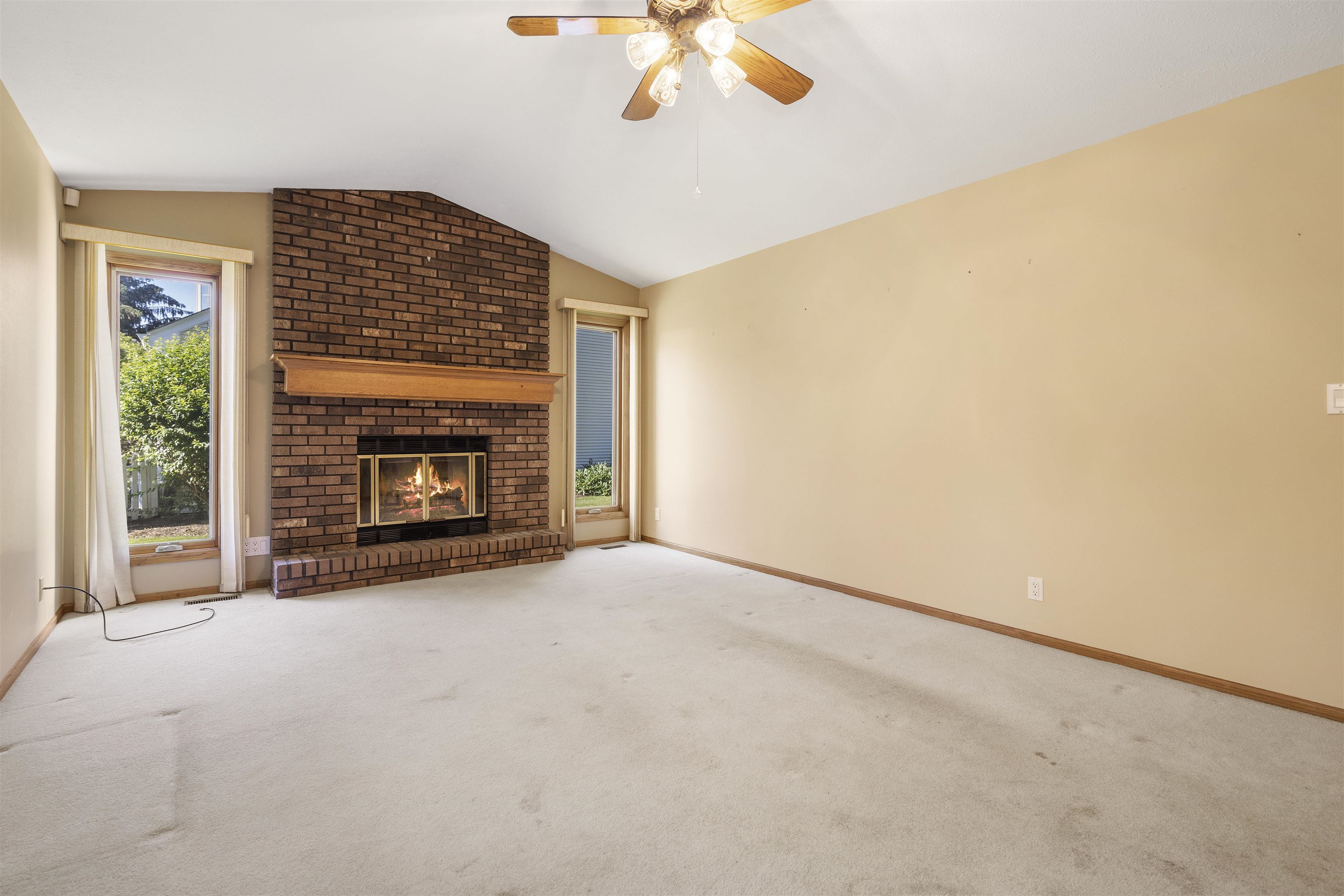 1732 Rowntree Lane Rockford, IL 61107 - Photo 4 of 26 a view of an empty room with a fireplace