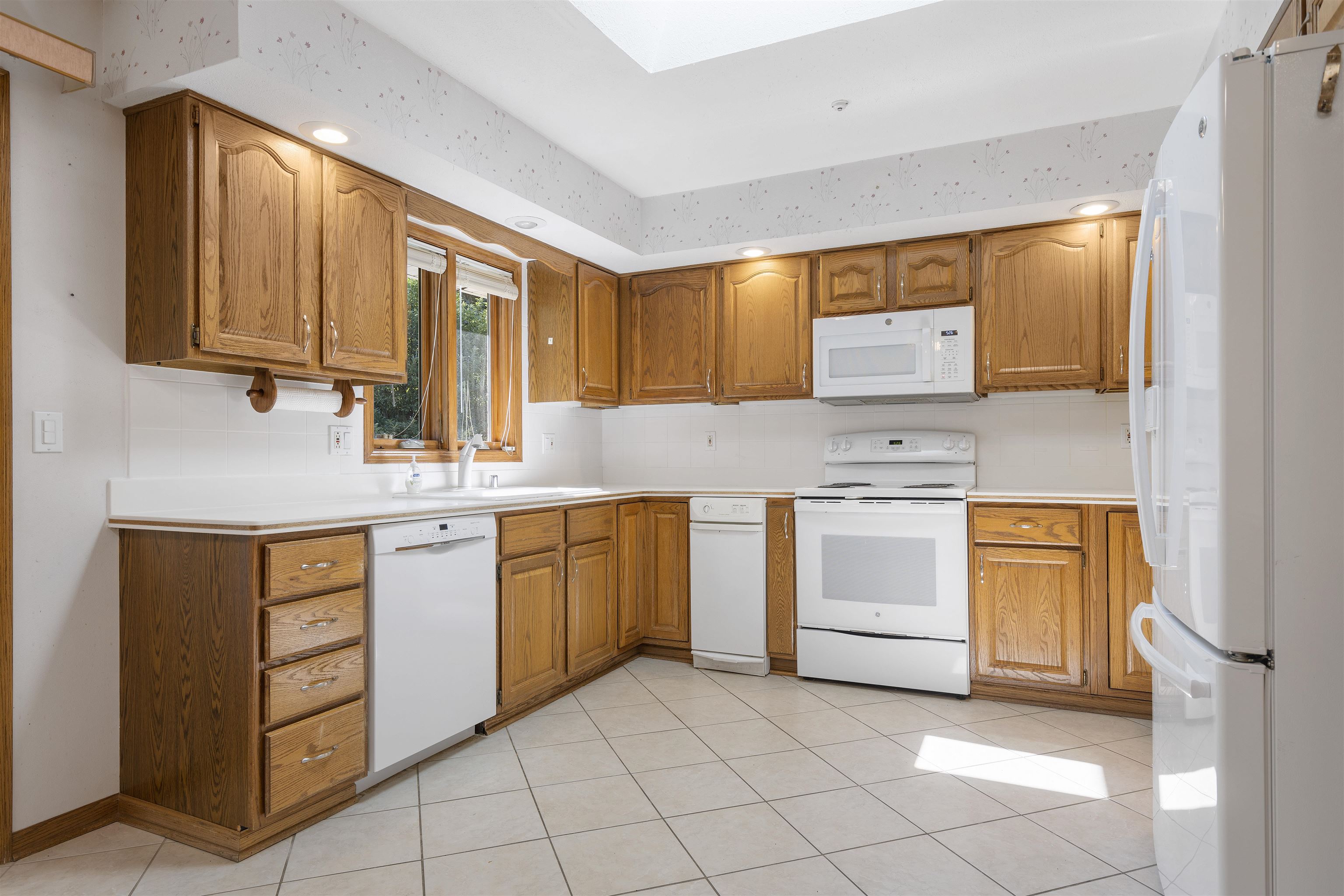 1732 Rowntree Lane Rockford, IL 61107 - Photo 6 of 26 a kitchen with a stove sink and cabinets