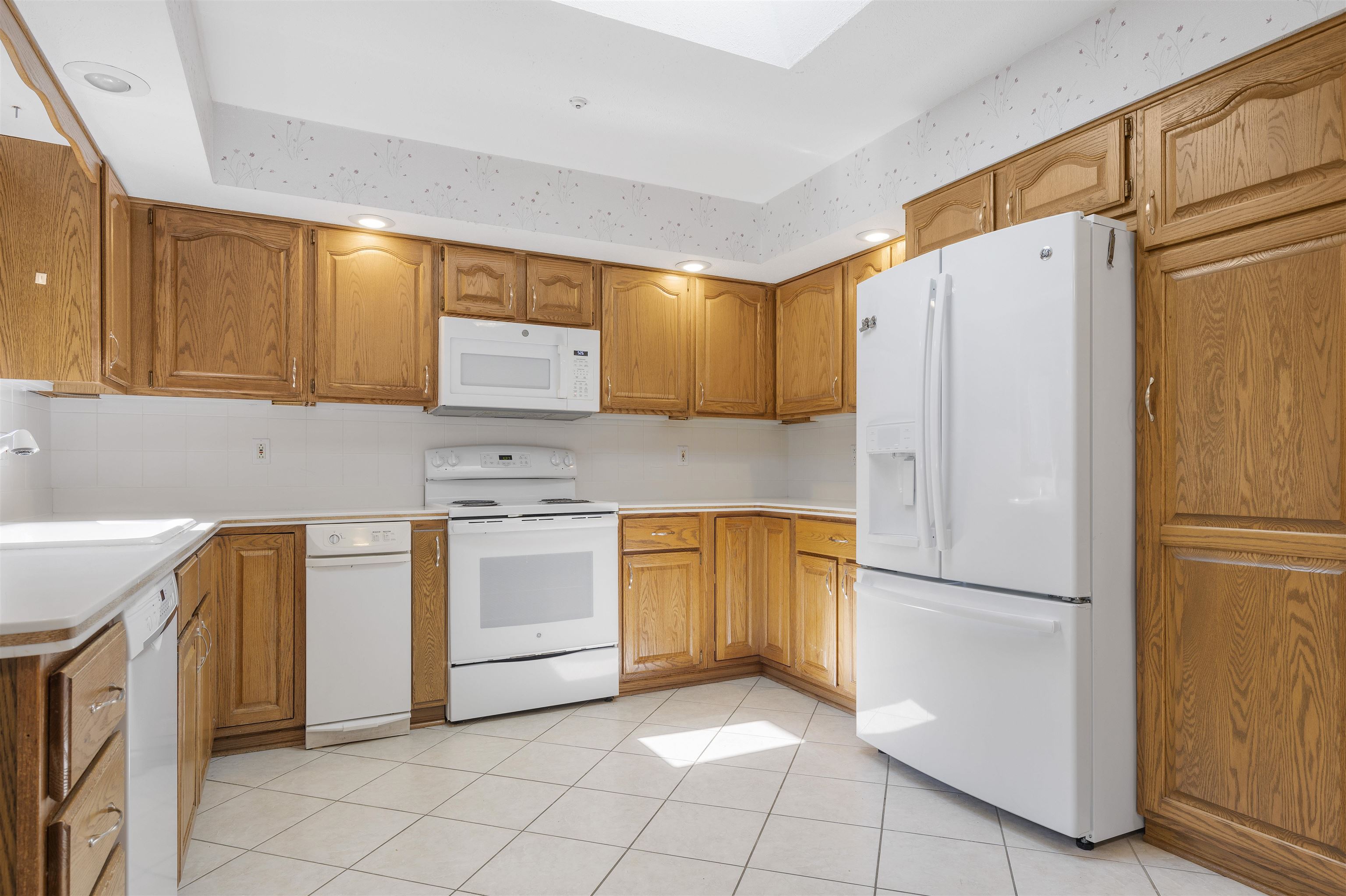 1732 Rowntree Lane Rockford, IL 61107 - Photo 7 of 26 a kitchen with stainless steel appliances granite countertop a refrigerator sink and stove