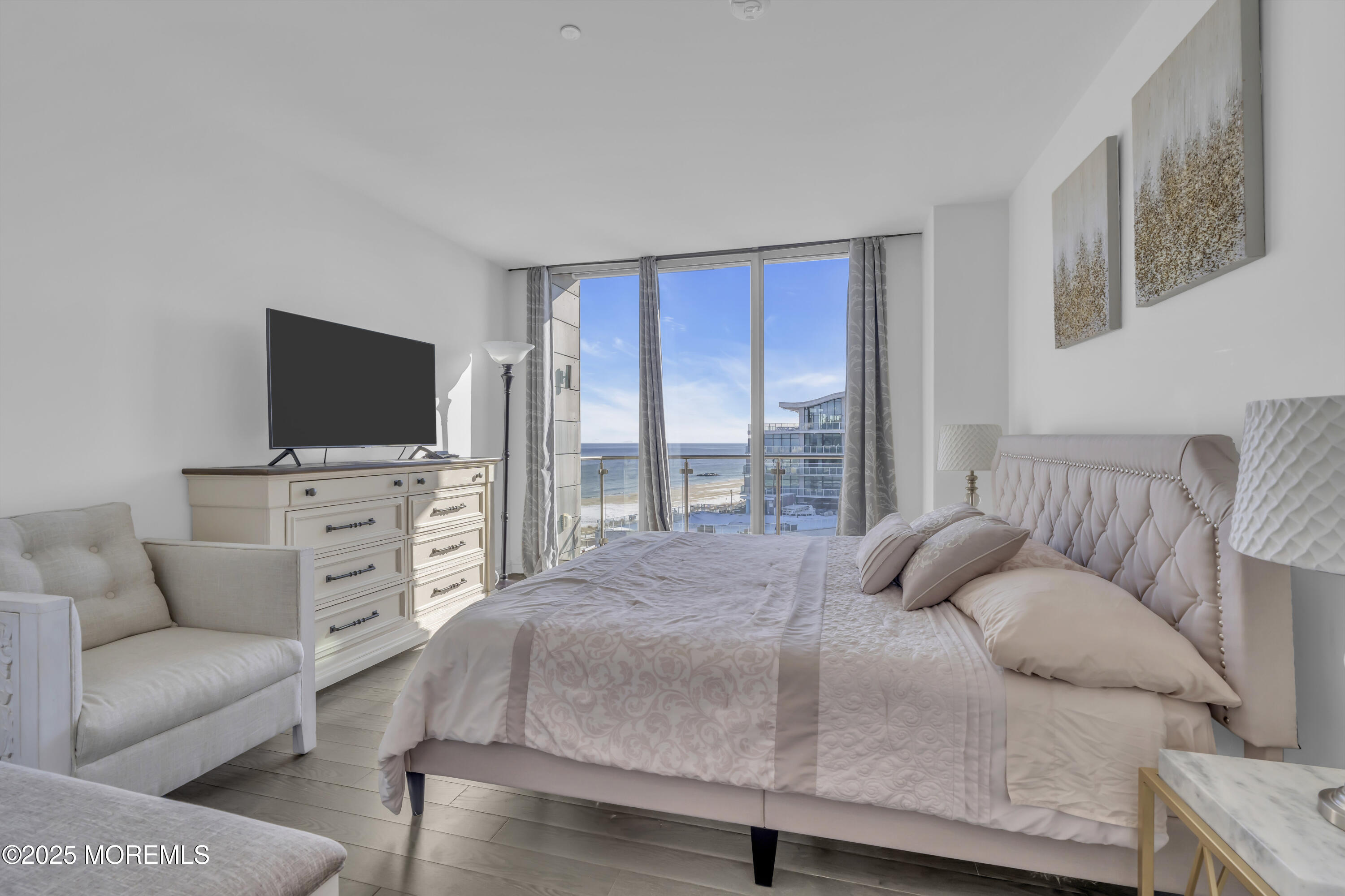 20 Melrose Terrace, Unit 509 Long Branch, NJ 07740 - Photo 13 of 24 a bedroom with a bed and a flat screen tv