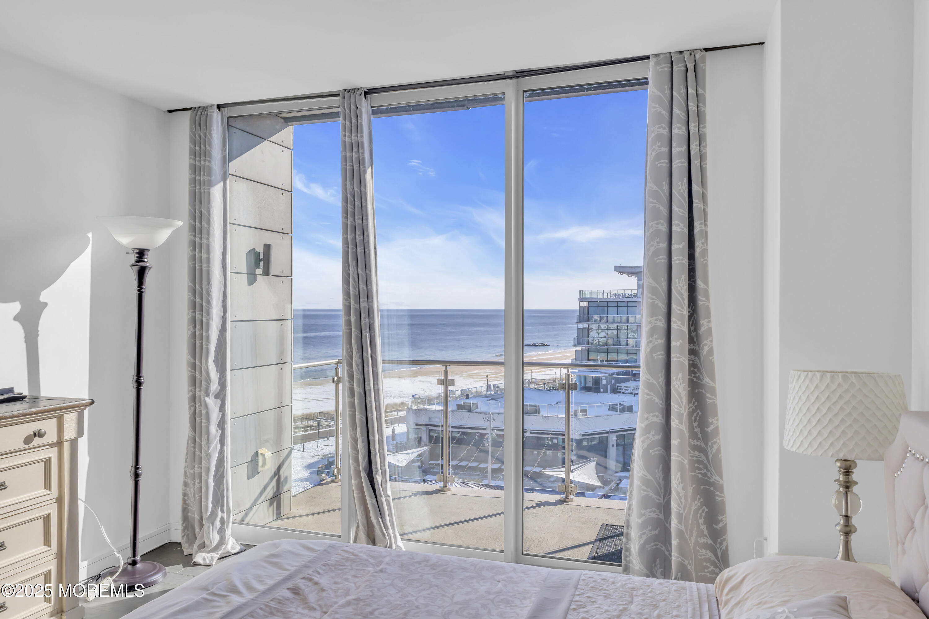 20 Melrose Terrace, Unit 509 Long Branch, NJ 07740 - Photo 14 of 24 a living room with a glass door shower