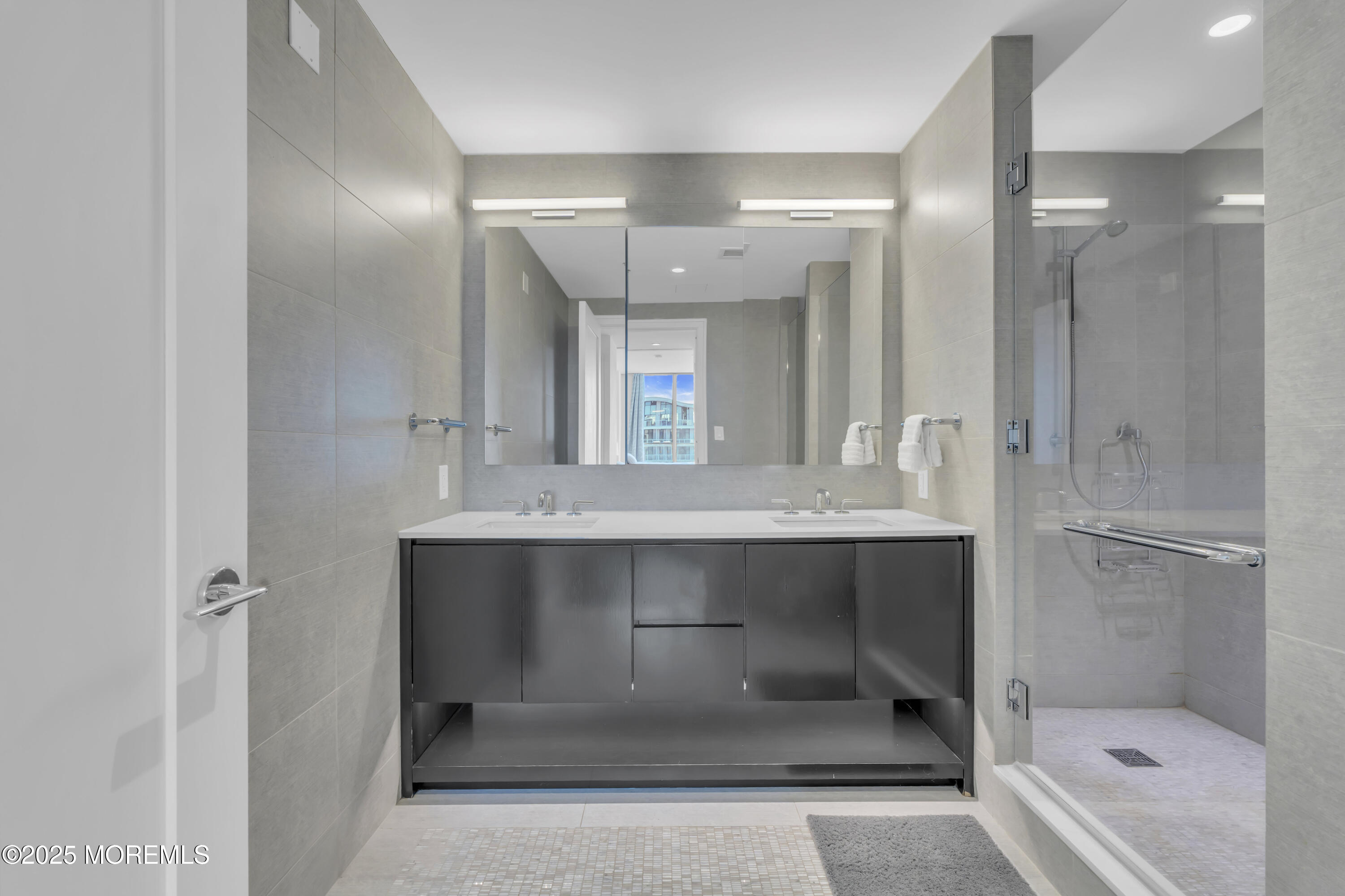 20 Melrose Terrace, Unit 509 Long Branch, NJ 07740 - Photo 15 of 24 a bathroom with a tub shower sink and mirror