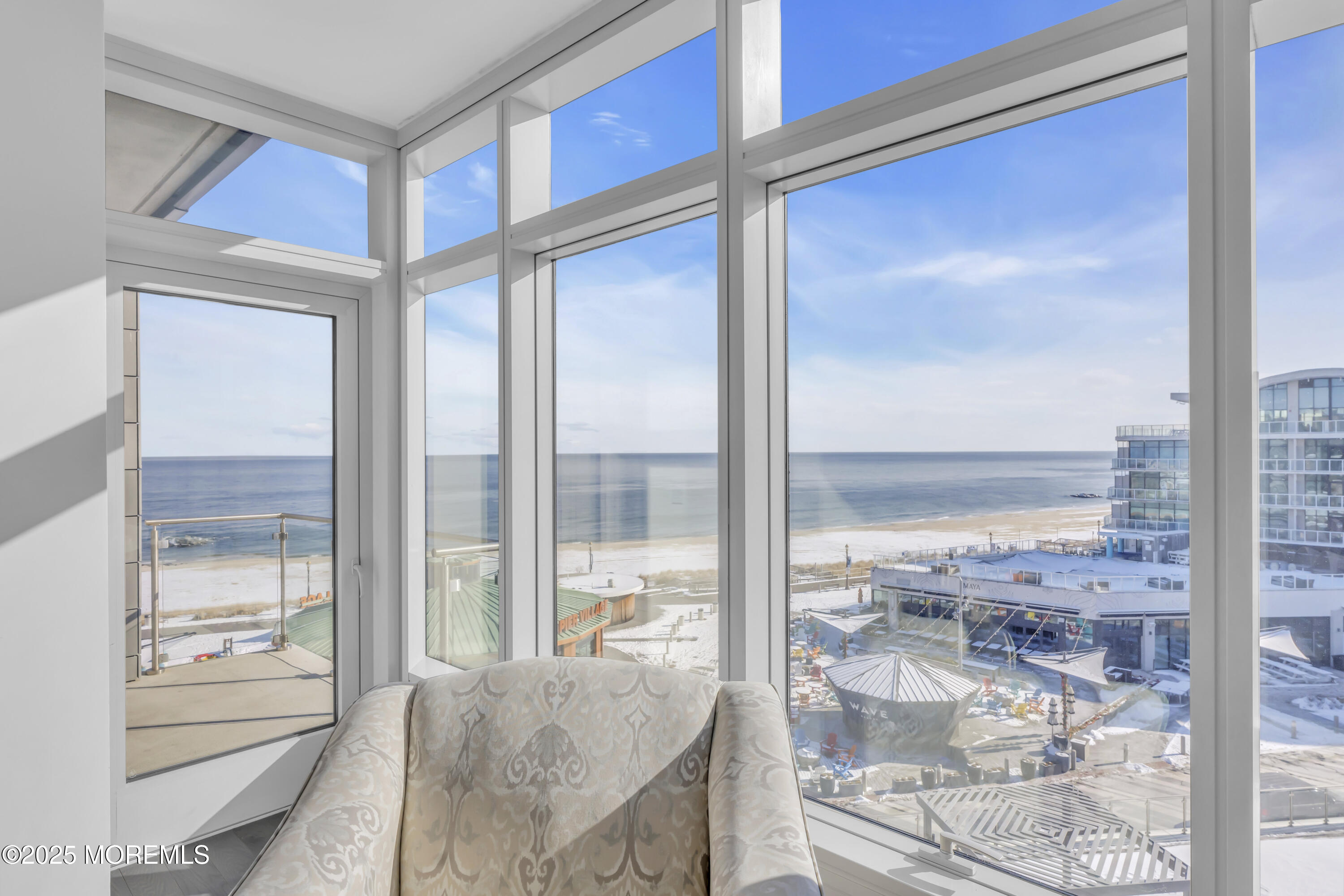 20 Melrose Terrace, Unit 509 Long Branch, NJ 07740 - Photo 3 of 24 a living room with a large window and table