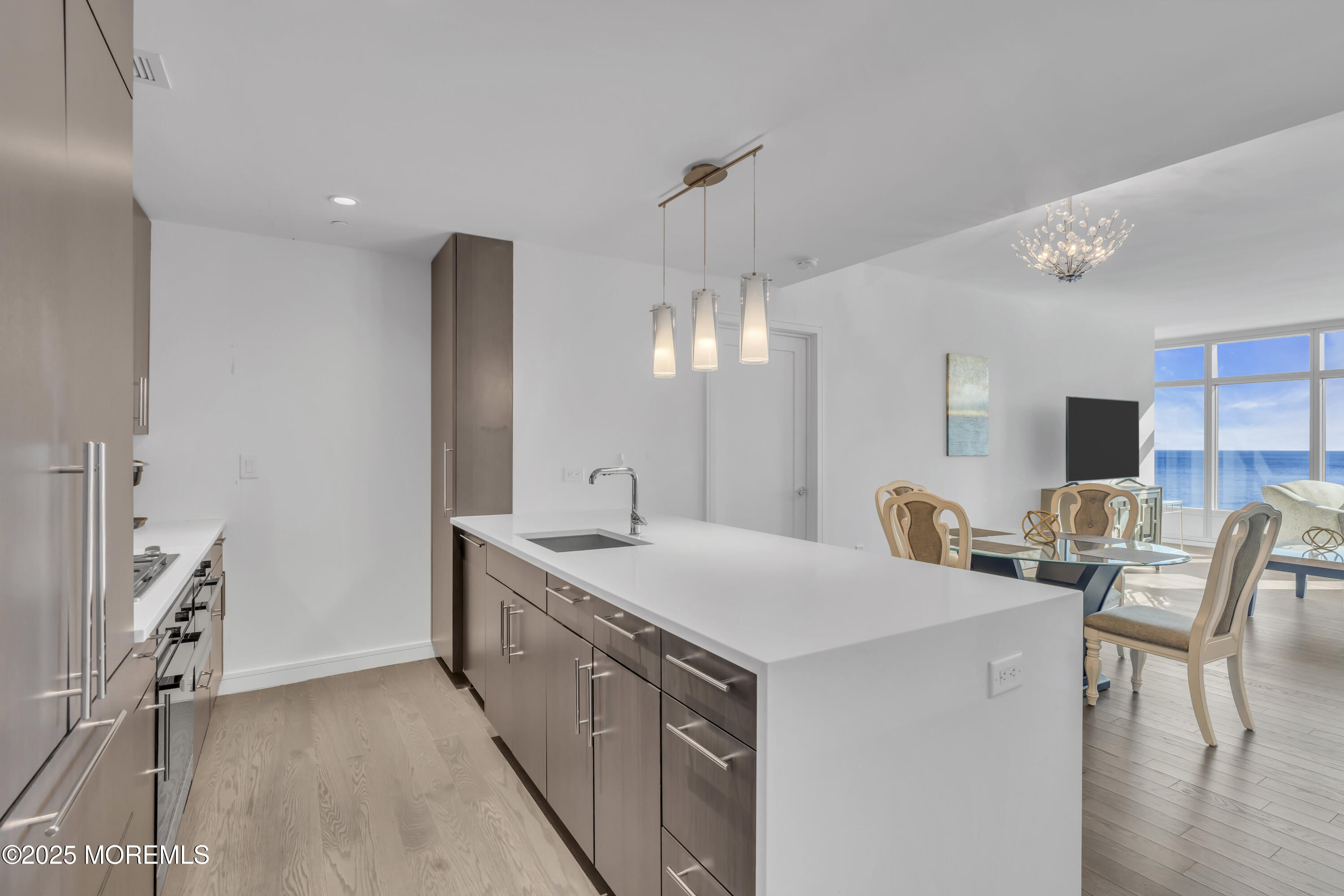 20 Melrose Terrace, Unit 509 Long Branch, NJ 07740 - Photo 4 of 24 a view of a kitchen counter space a sink and a refrigerator