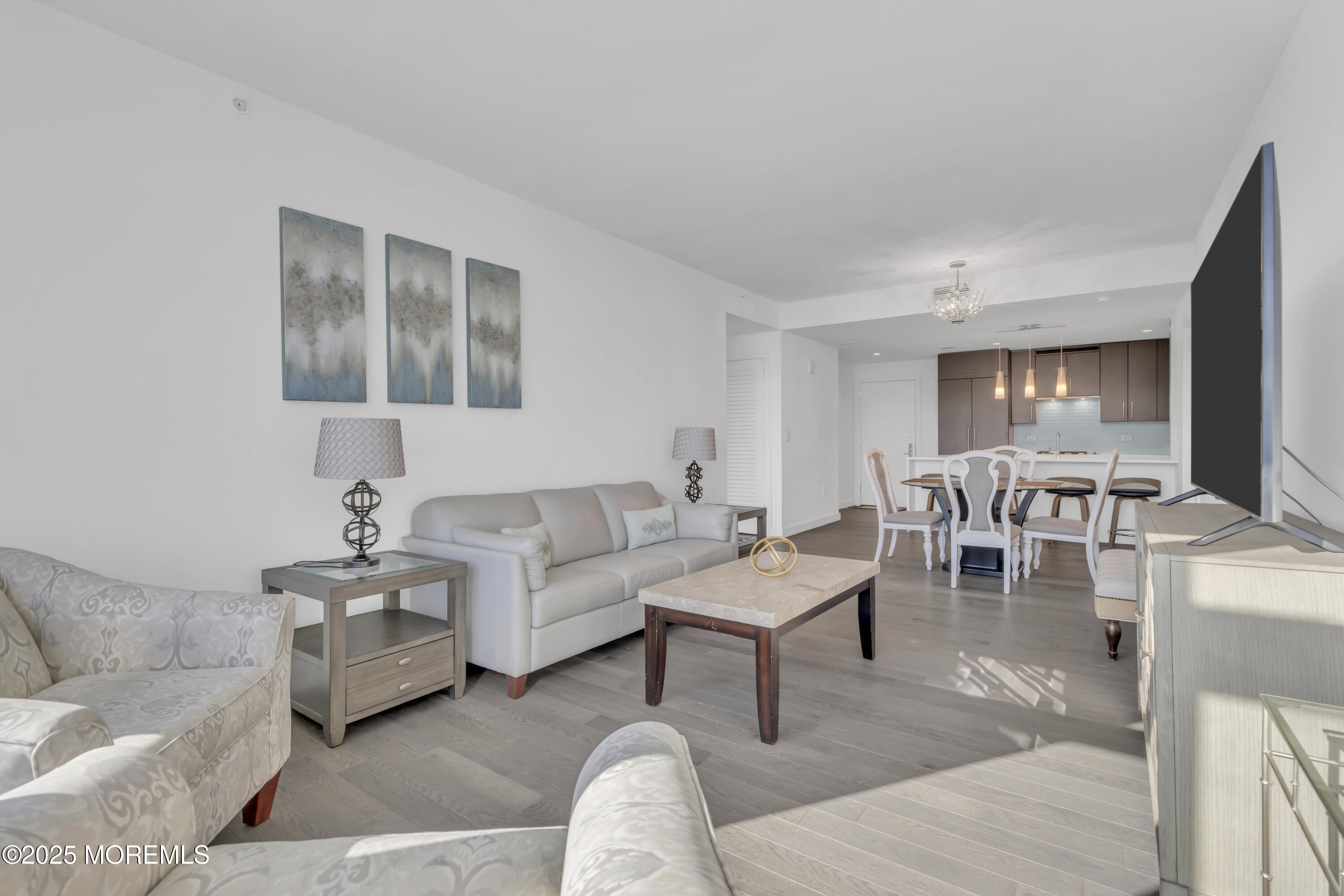 20 Melrose Terrace, Unit 509 Long Branch, NJ 07740 - Photo 6 of 24 a living room with furniture and a view of kitchen
