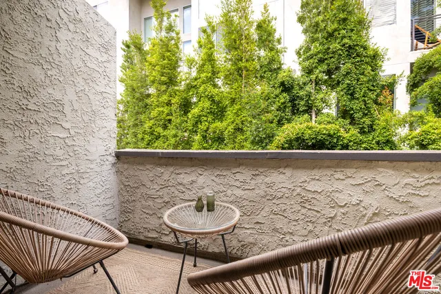 a view of a small yard from a balcony