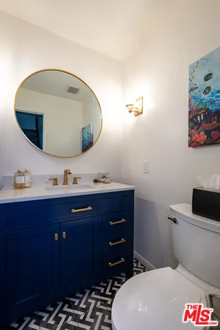 a bathroom with a sink and mirror