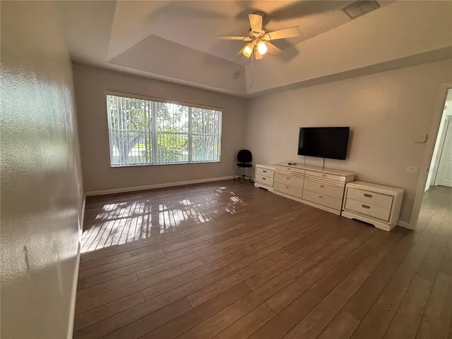 a bathroom with a double vanity sink a toilet a mirror and shower