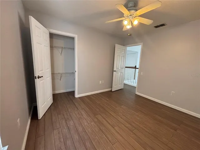 a view of a porch with a floor to ceiling window next to a yard