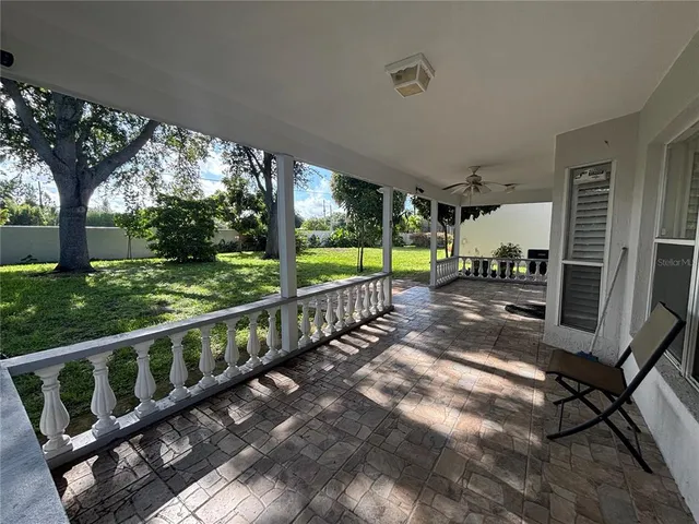 a view of a backyard with large trees
